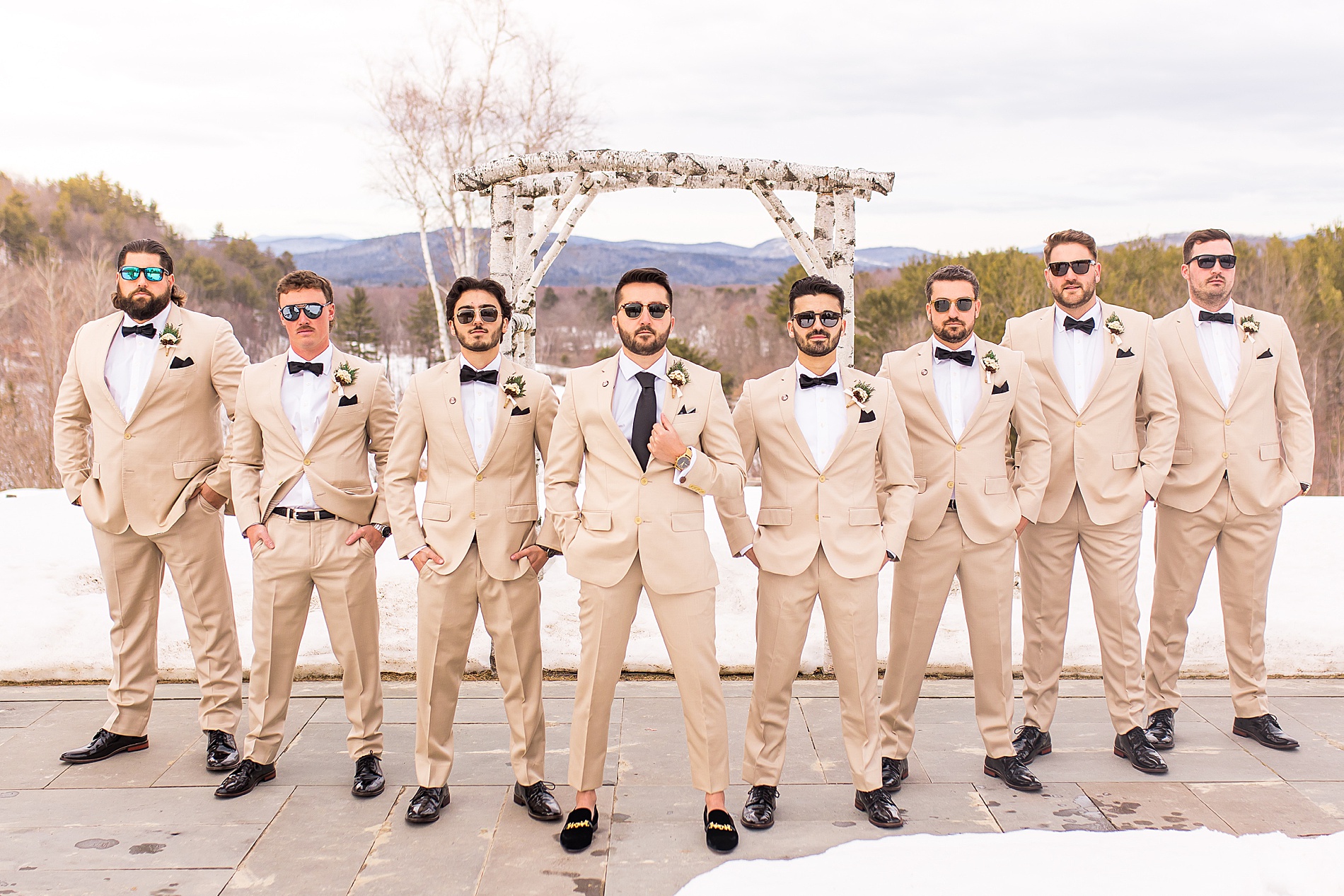 groom and groomsmen in tan suits 