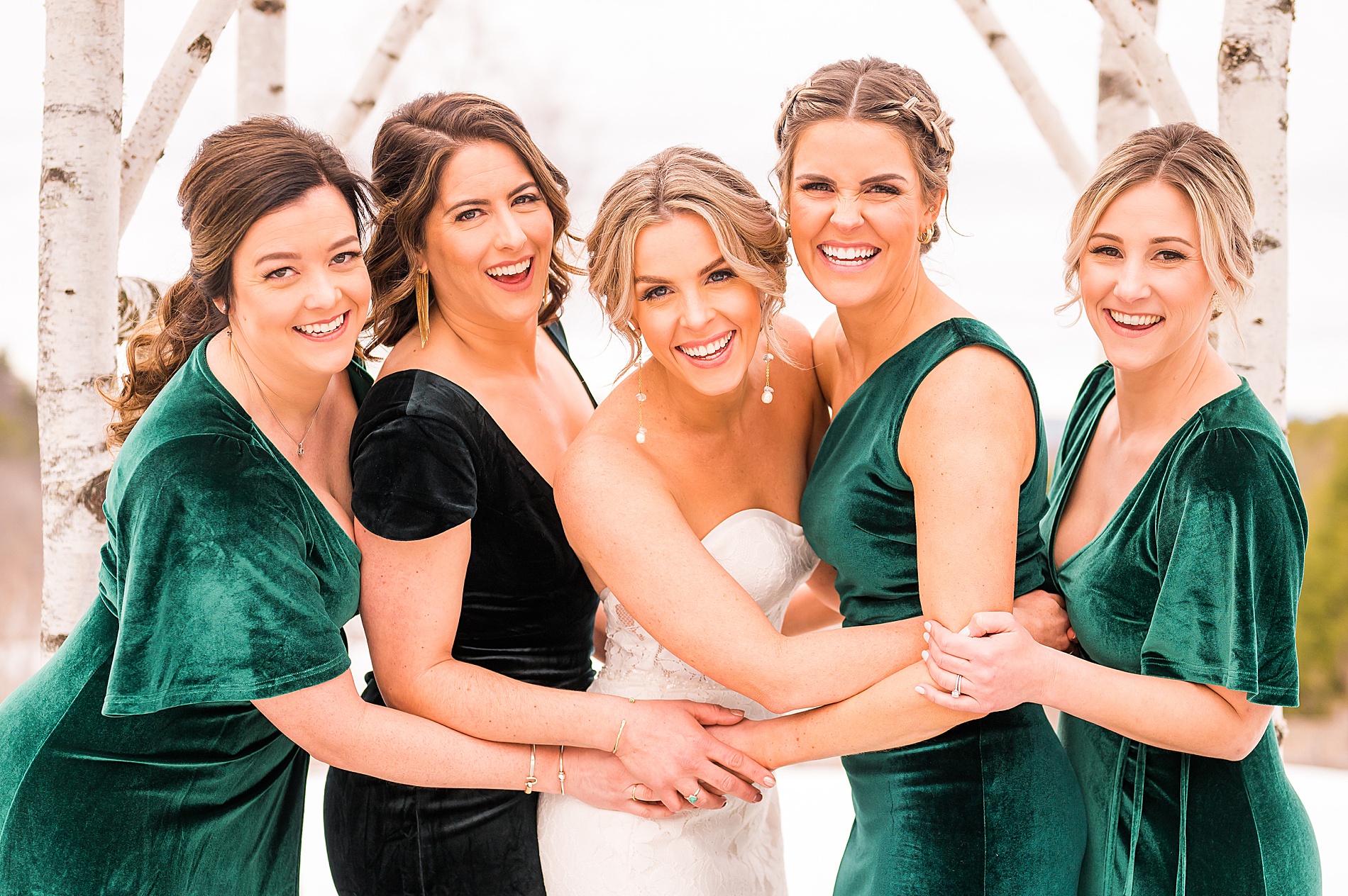 bride and bridesmaids in winter green dresses