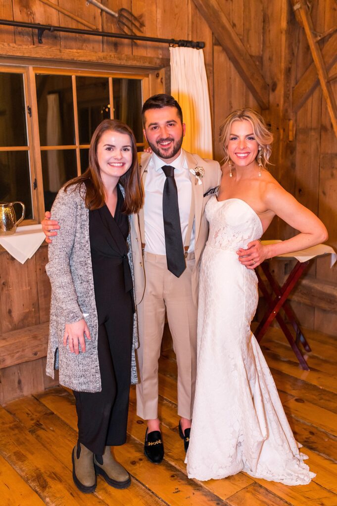 Southern NH wedding photographer Allison Clarke with couple at Barn on the Pemi winter wedding