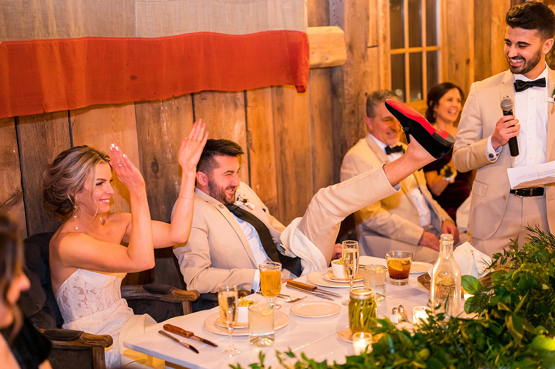 candid moment during Elegant NH Winter Wedding reception at the Barn on the Pemi