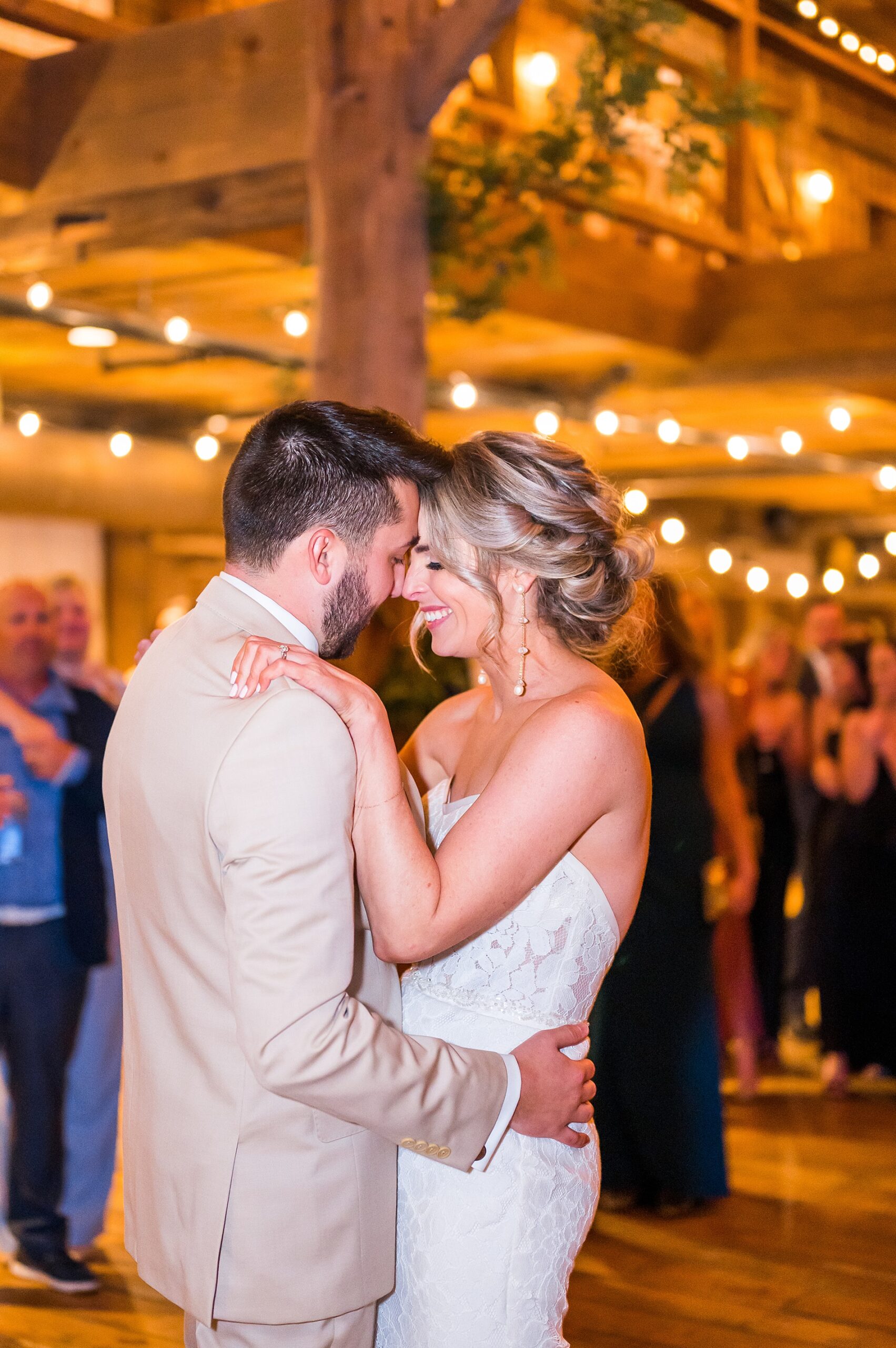 newlyweds share first dance at reception
