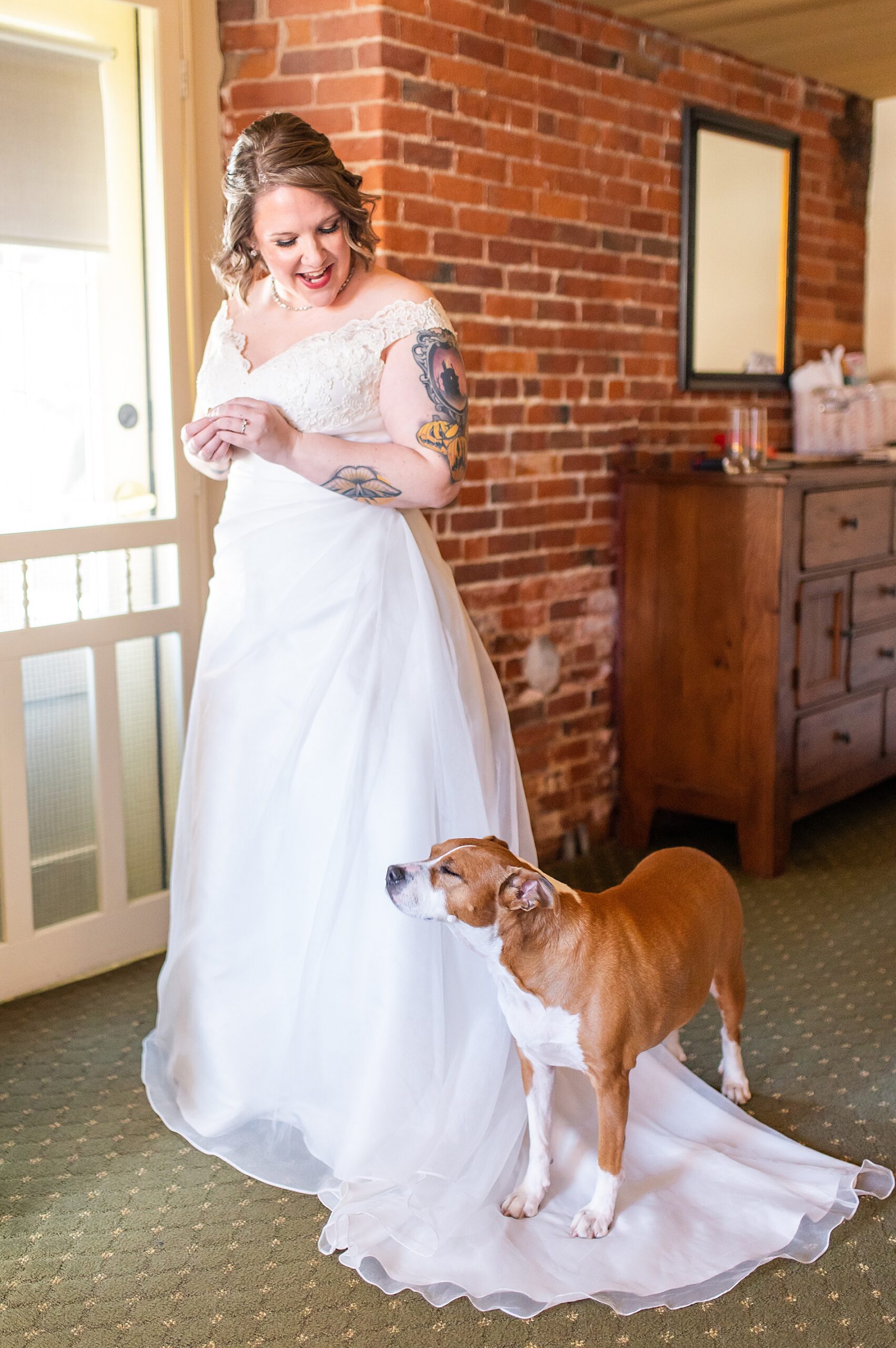 bride in wedding dress with dog