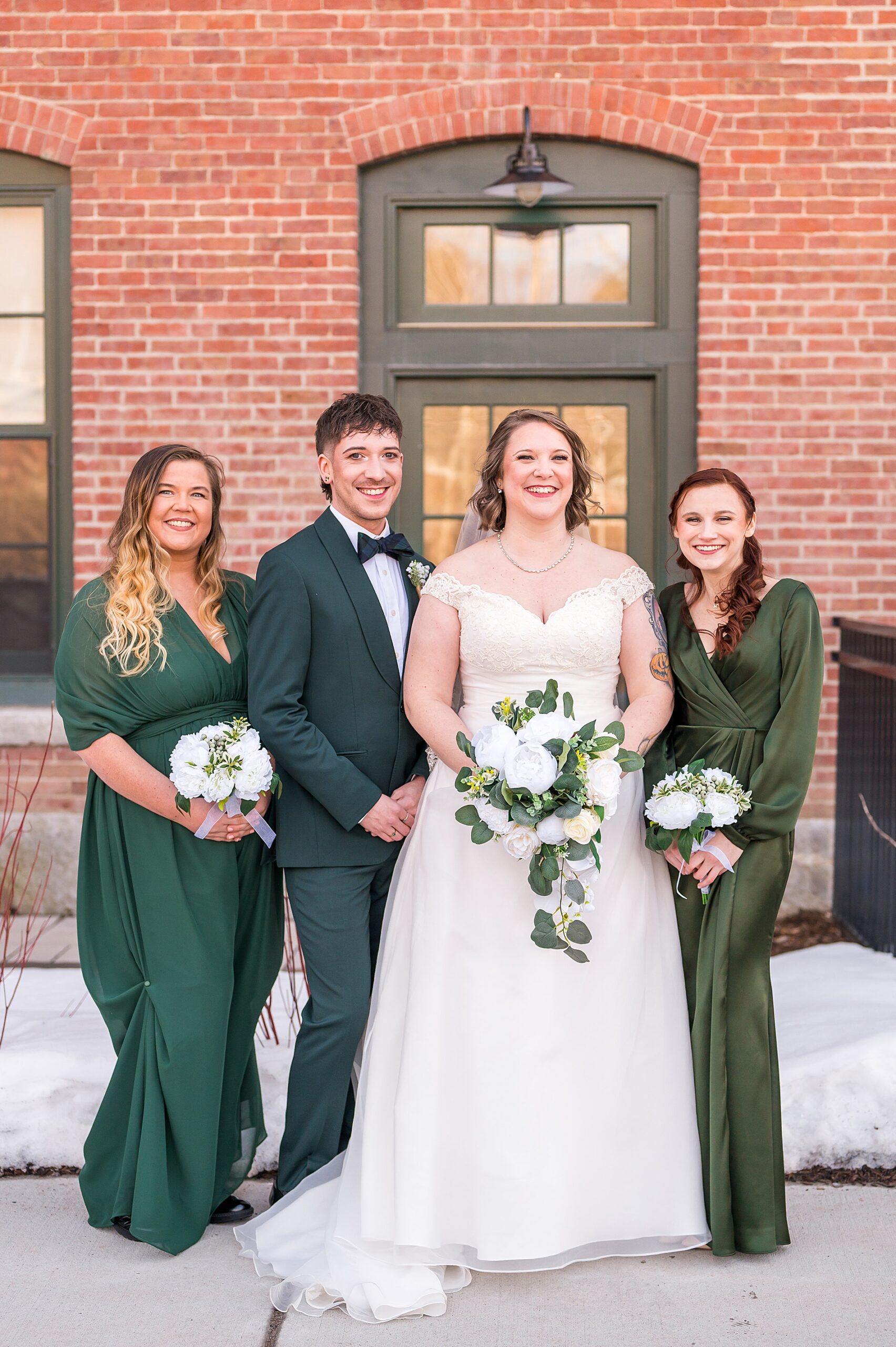 bride with wedding party from Claremont New Hampshire Wedding at The Common Man Inn