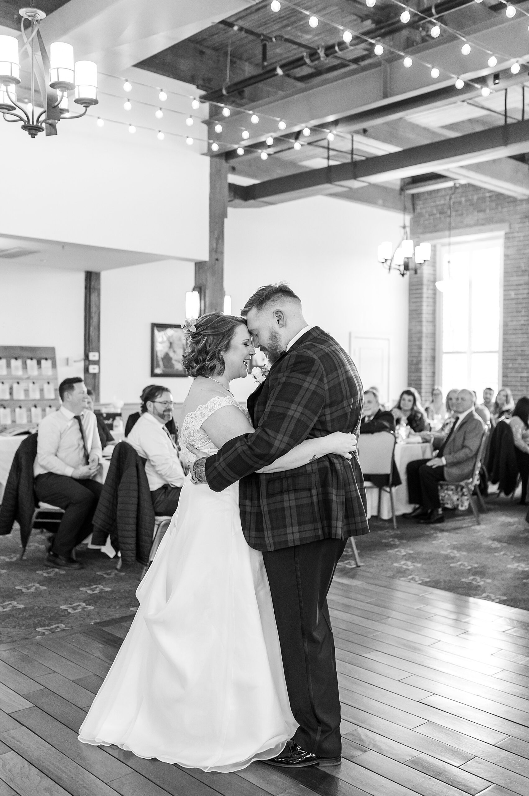 intimate moment between bride and groom sharing first dance together