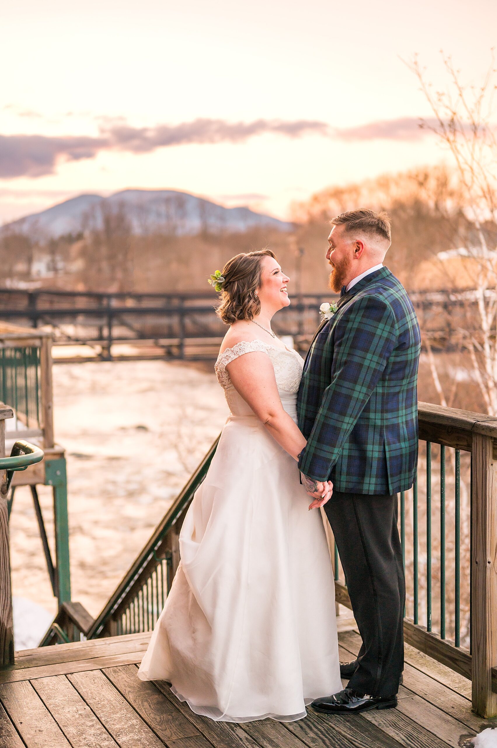 sunset wedding portraits by the water from Claremont New Hampshire Wedding at The Common Man Inn