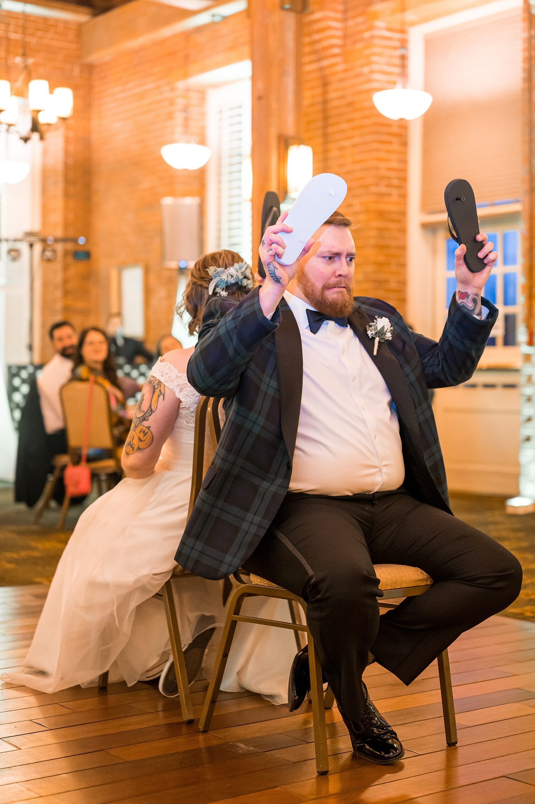 fun and candid moment of bride and groom during shoe game
