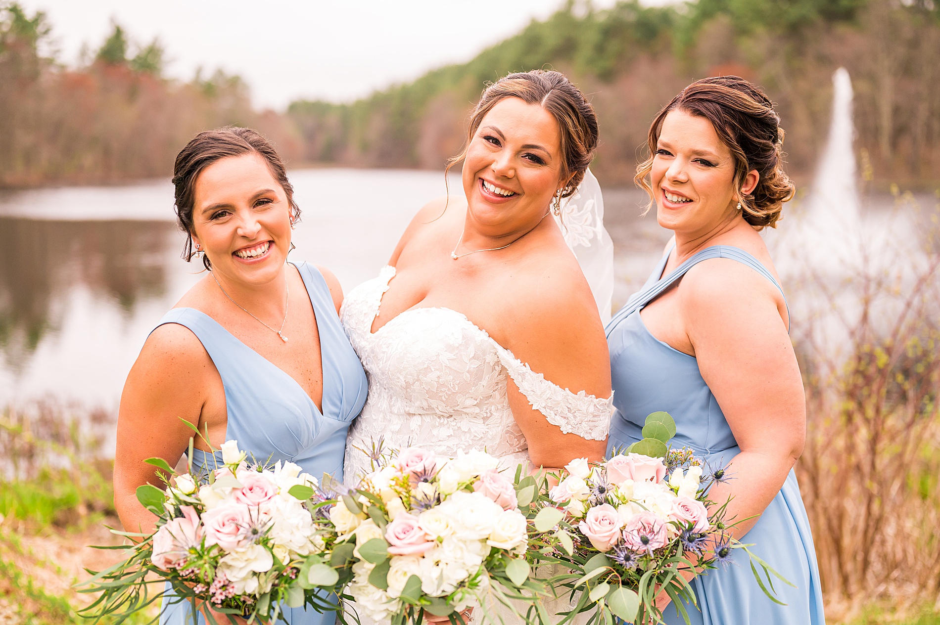 bride and bridesmaids in steel blue dresses 
