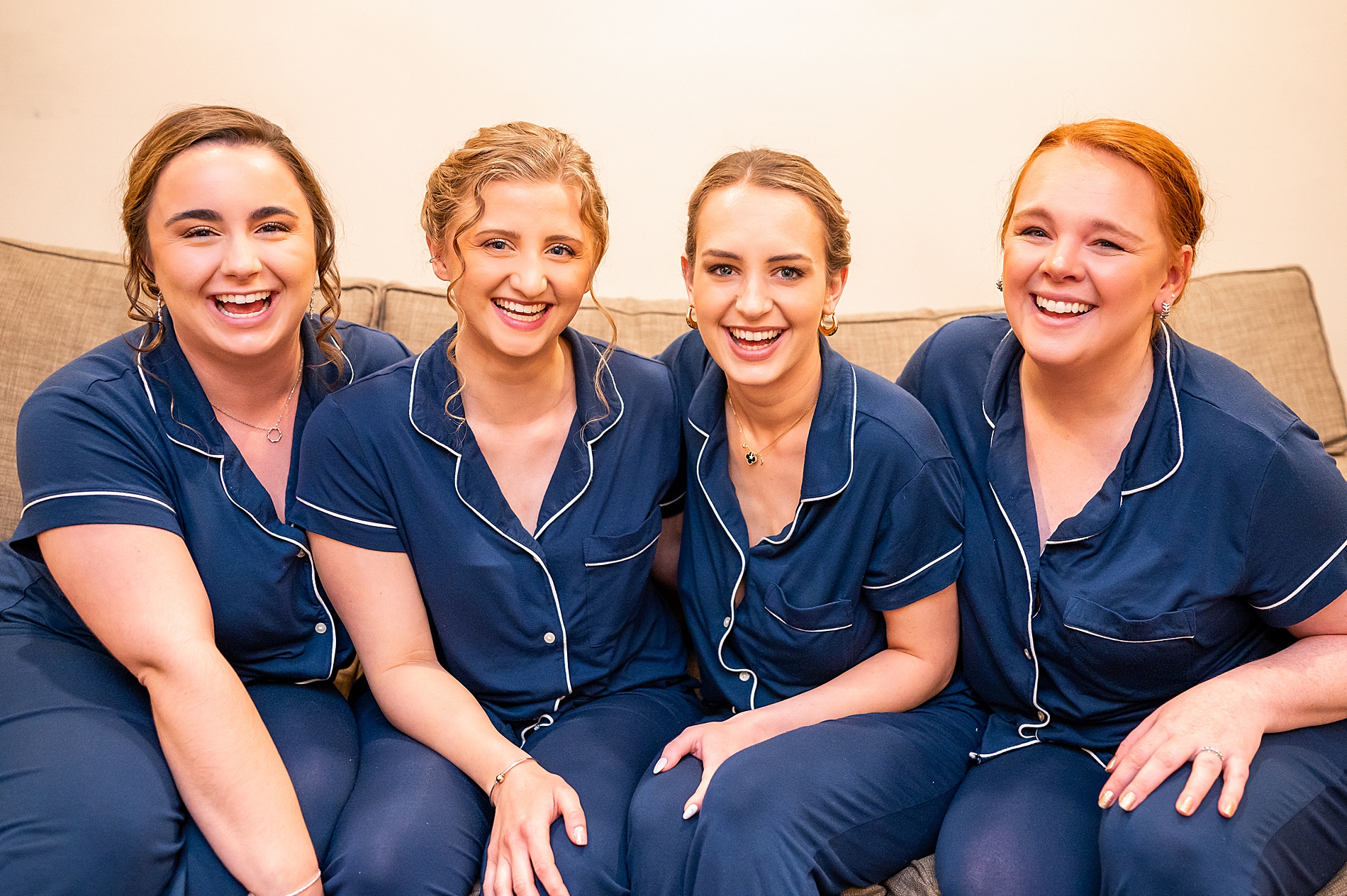 bride and bridesmaids in matching navy pjs