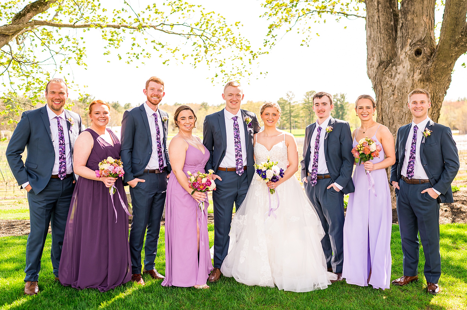 wedding party portraits after outdoor wedding ceremony 
