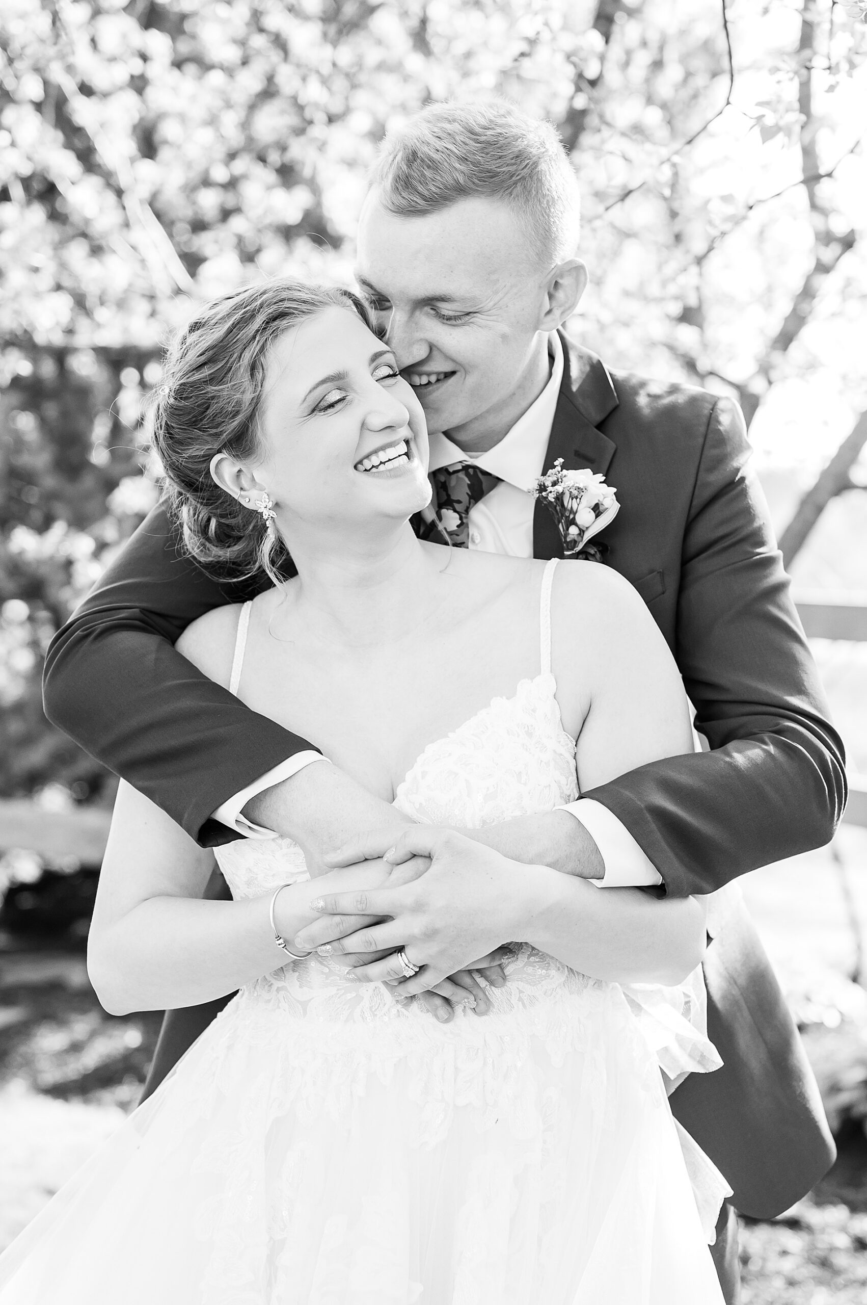 couple laugh as they enjoy a moment together after their wedding 