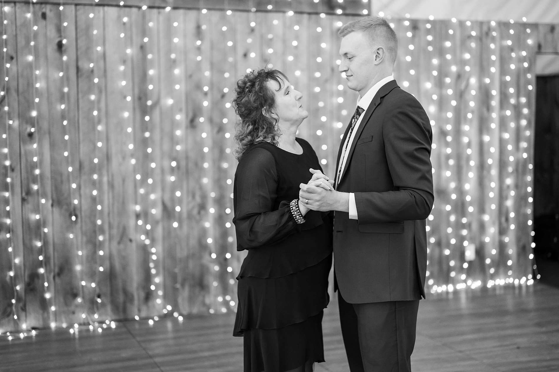 groom dances with his mother during Flag Hill Winery Wedding reception