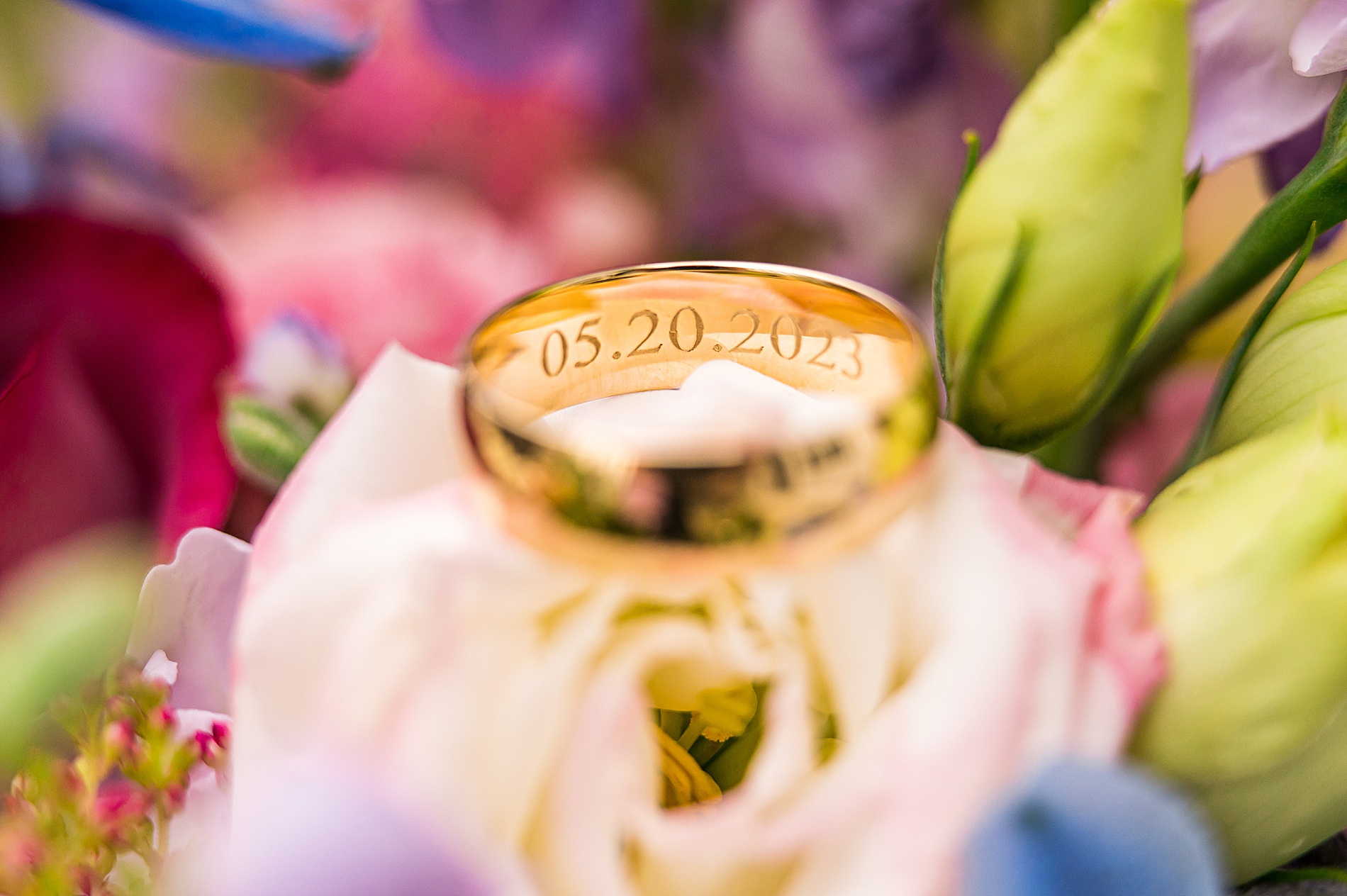 groom's wedding ring with engraved date