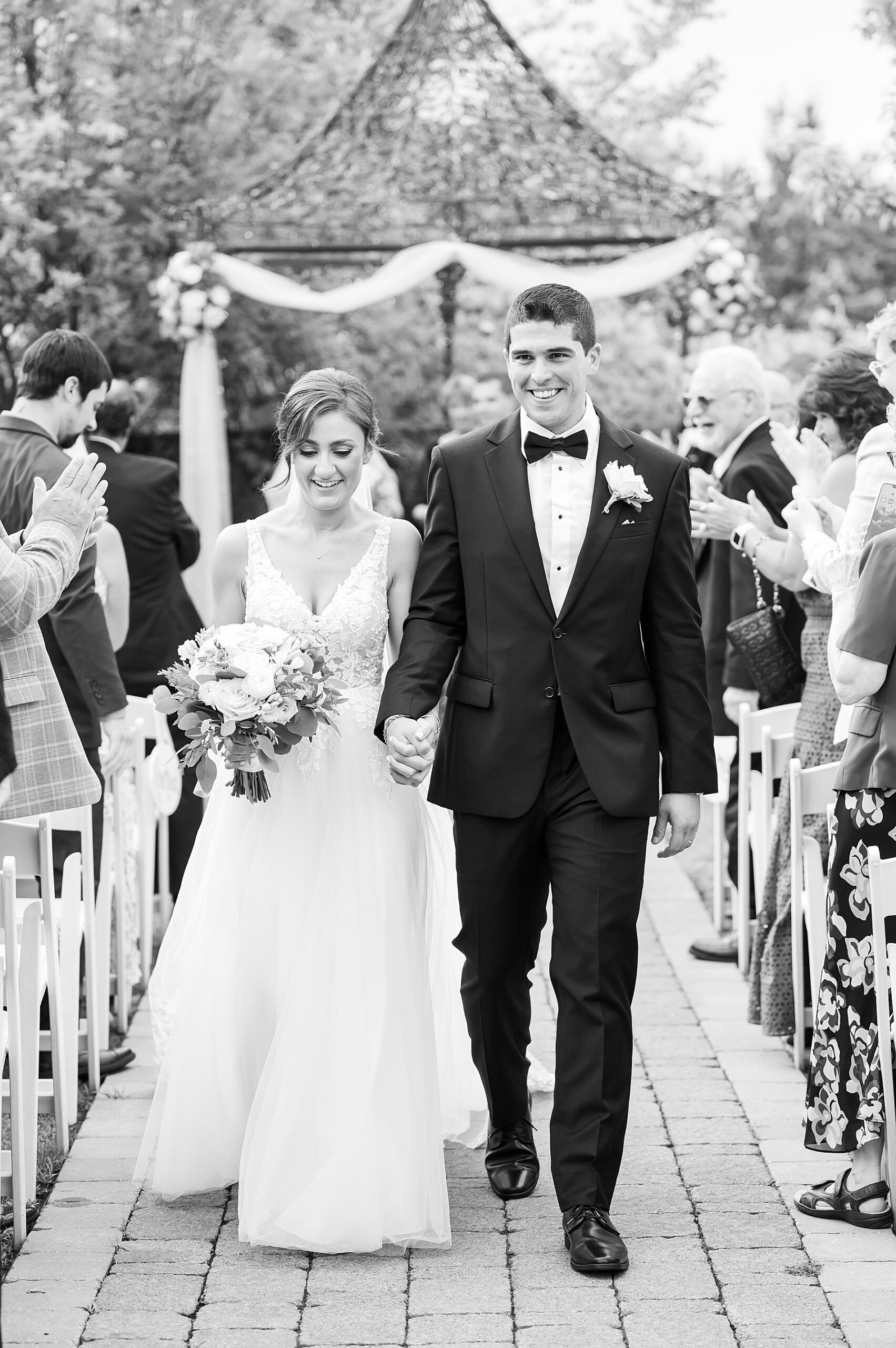 couple exit wedding ceremony at Granite Rose by Wedgewood Weddings