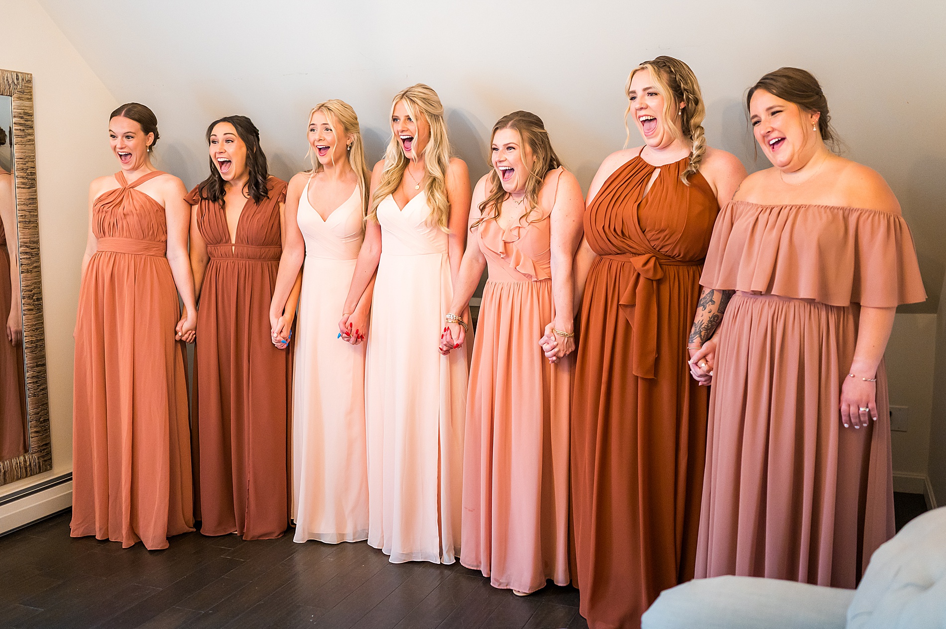 bridesmaids react to seeing bride in her dress before Romantic Thompson Inn Wedding