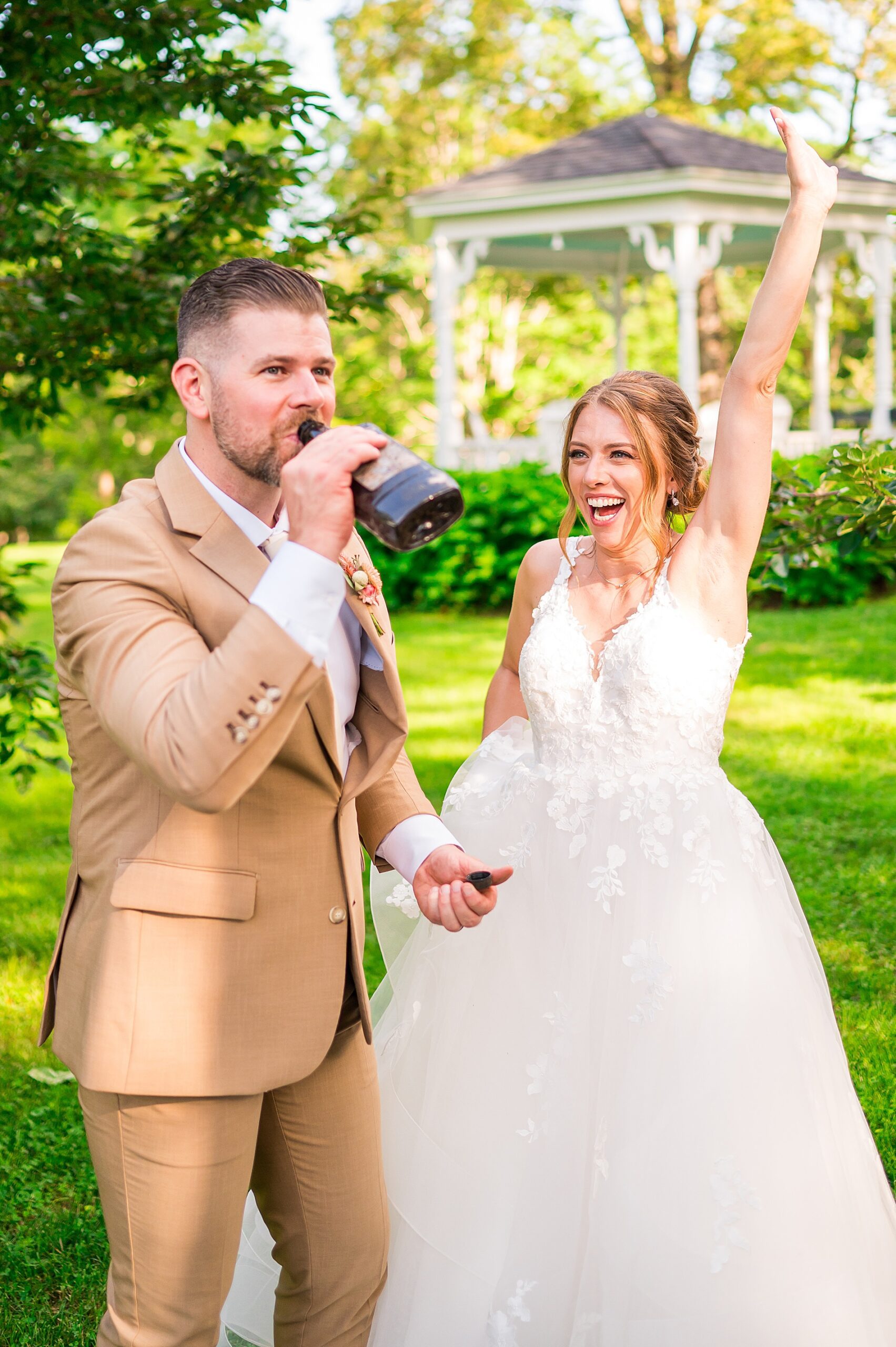 newlyweds drink from bottle of bourbon - a southern wedding tradition 