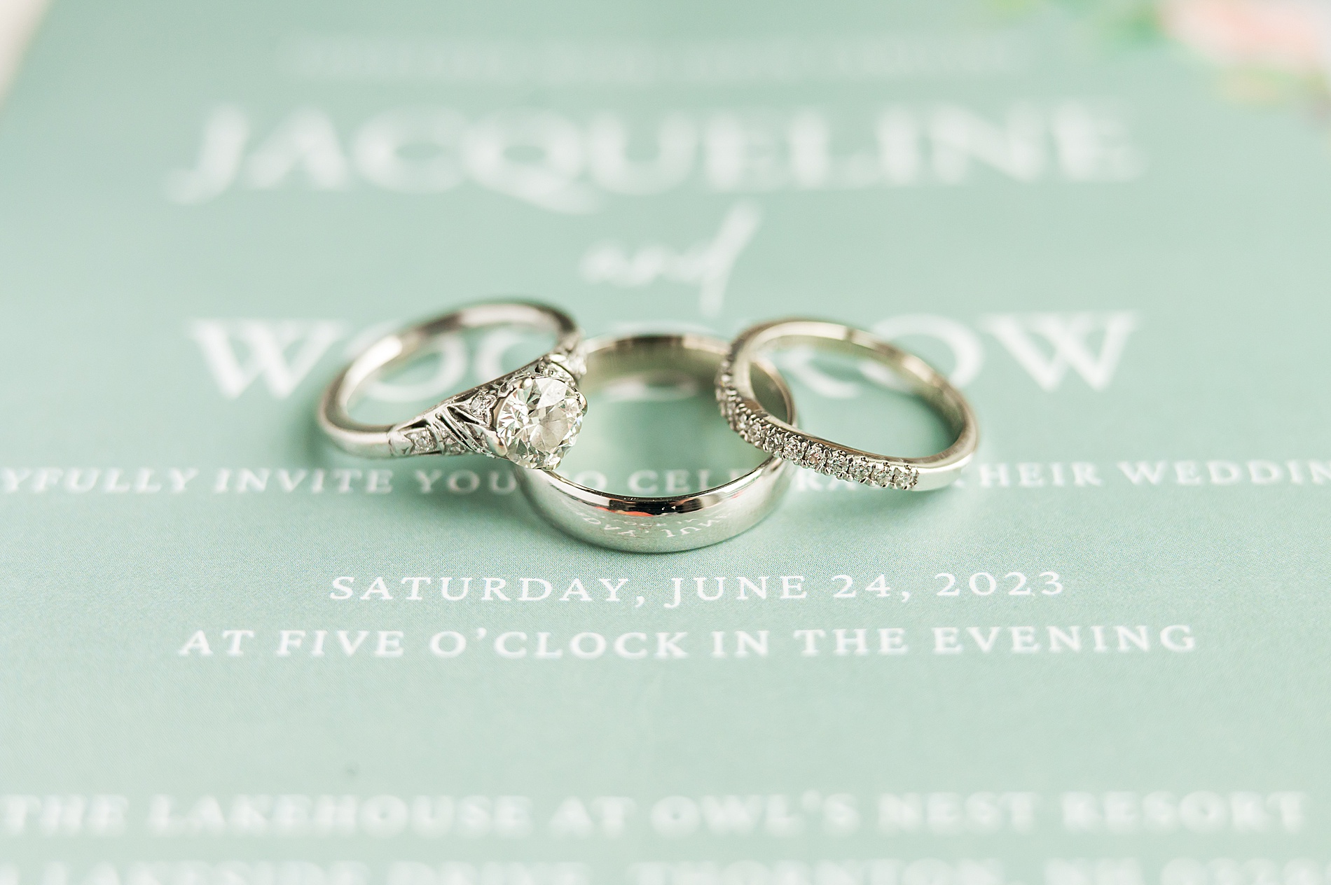 wedding rings on sage green wedding invitations