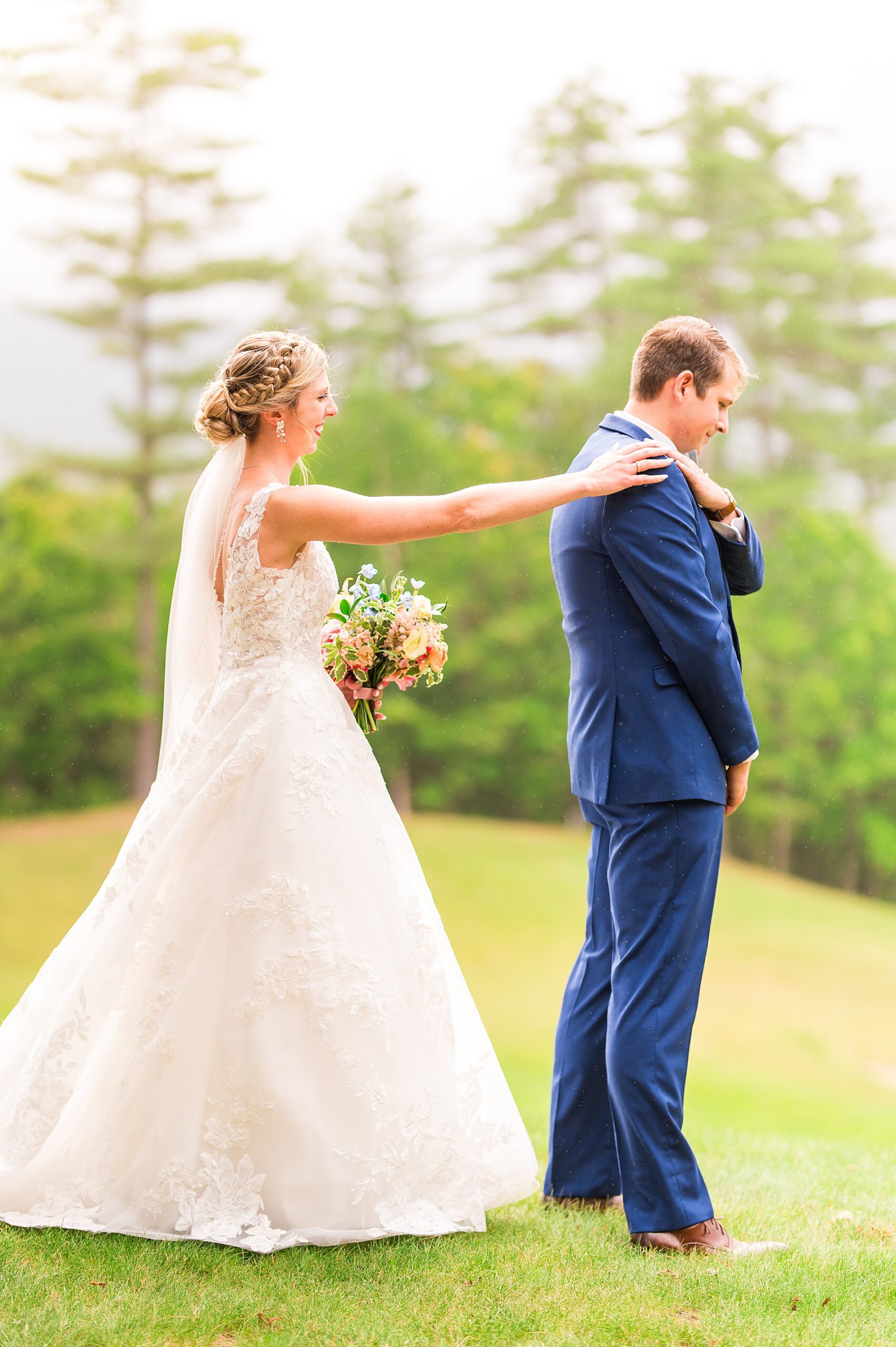 bride and grooms first look before  Summer Wedding at Owl's Nest Resort  