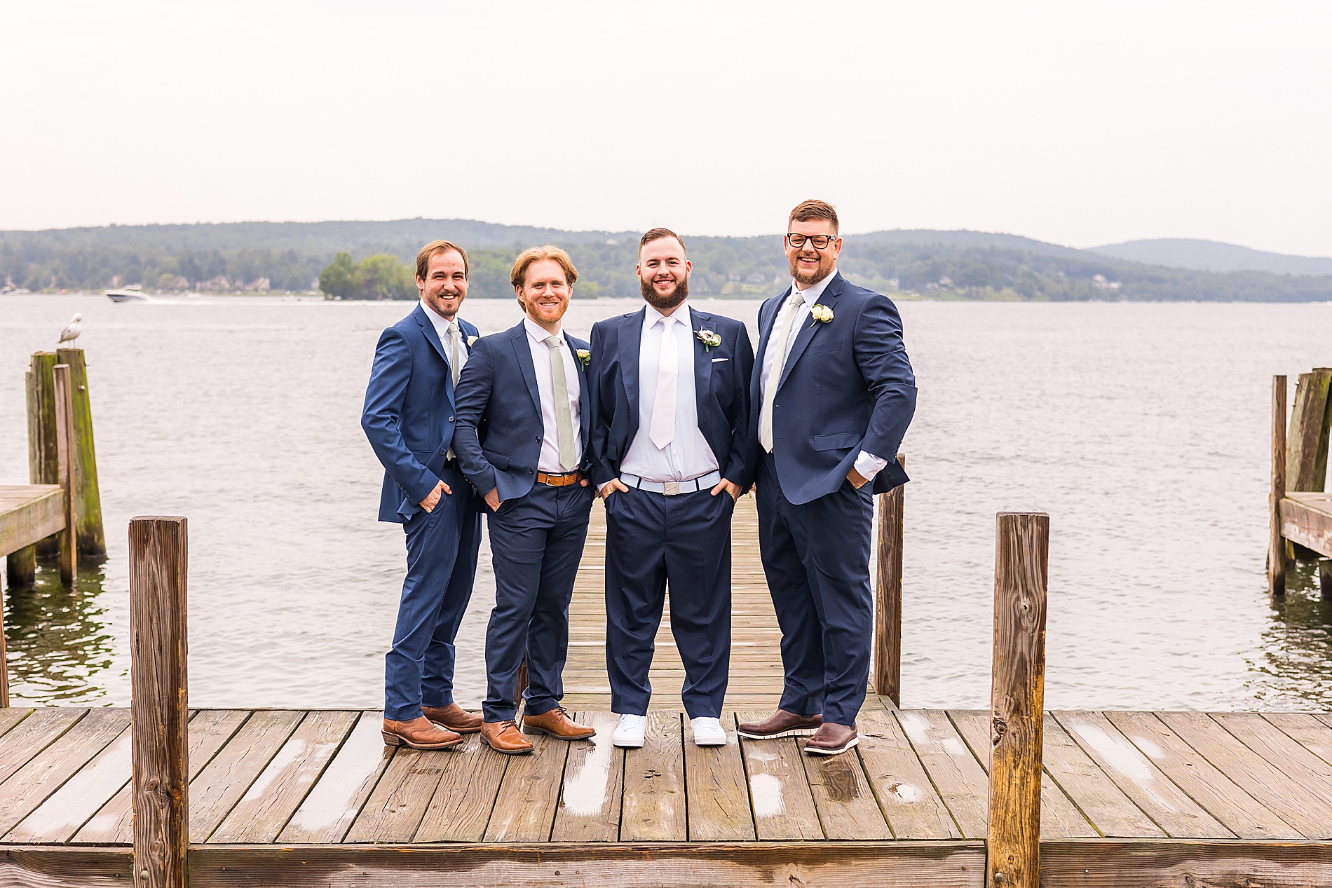 groom and groomsmen on docks at Waterfront Wedding at The Margate