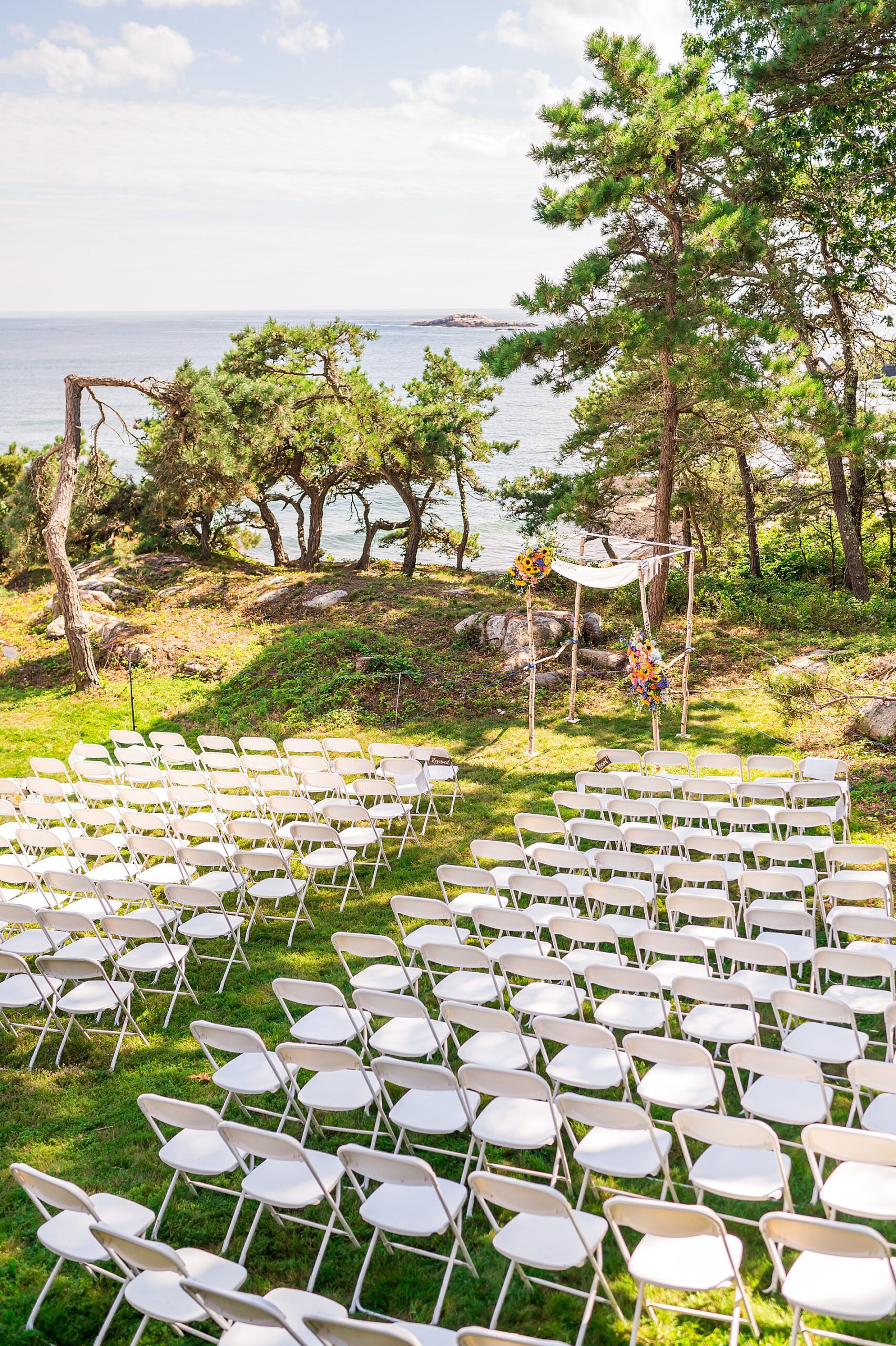 outdoor wedding ceremony facing ocean 