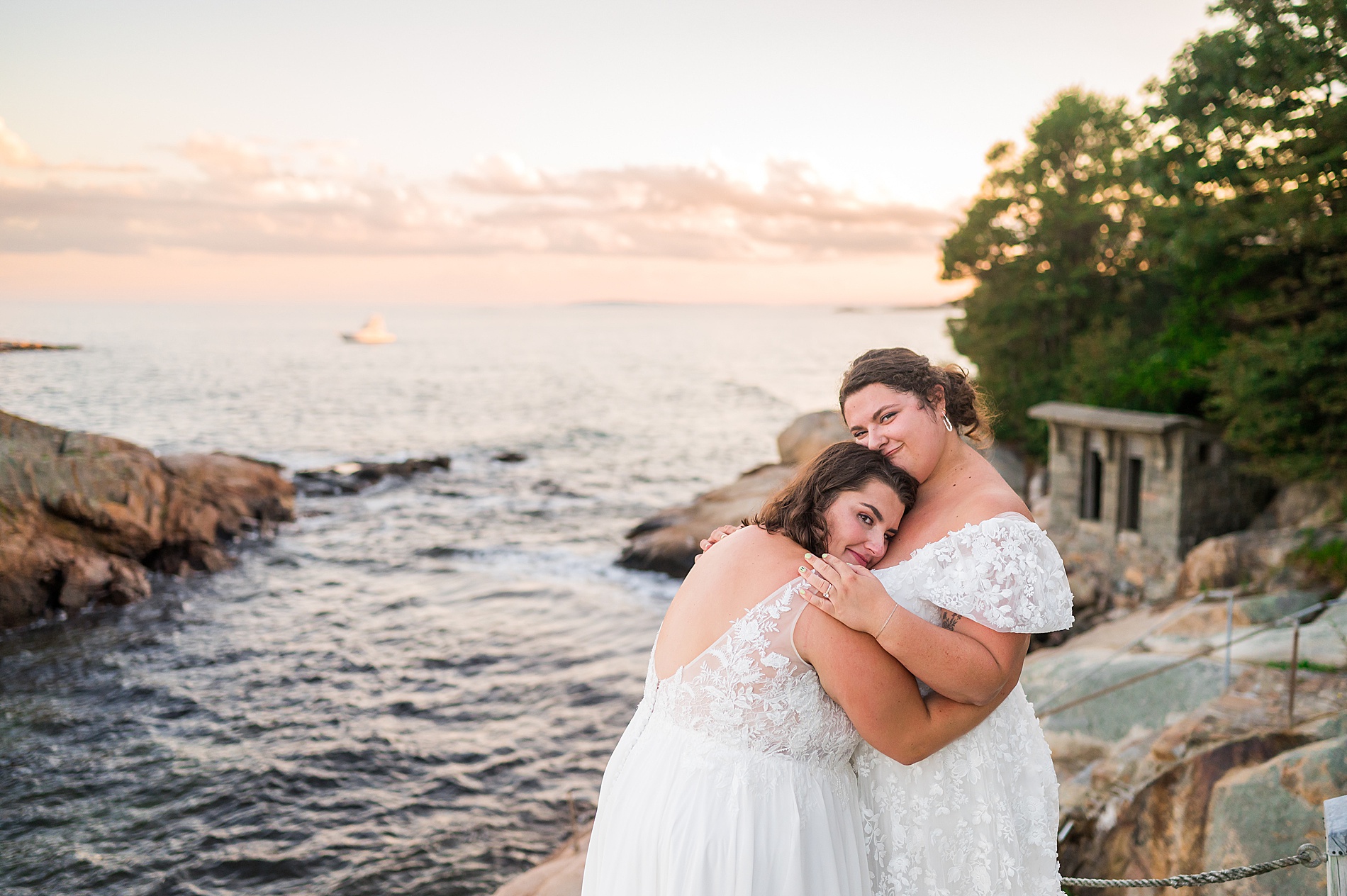 newlyweds hug during wedding portraits by the ocean from Manchester by the Sea Wedding