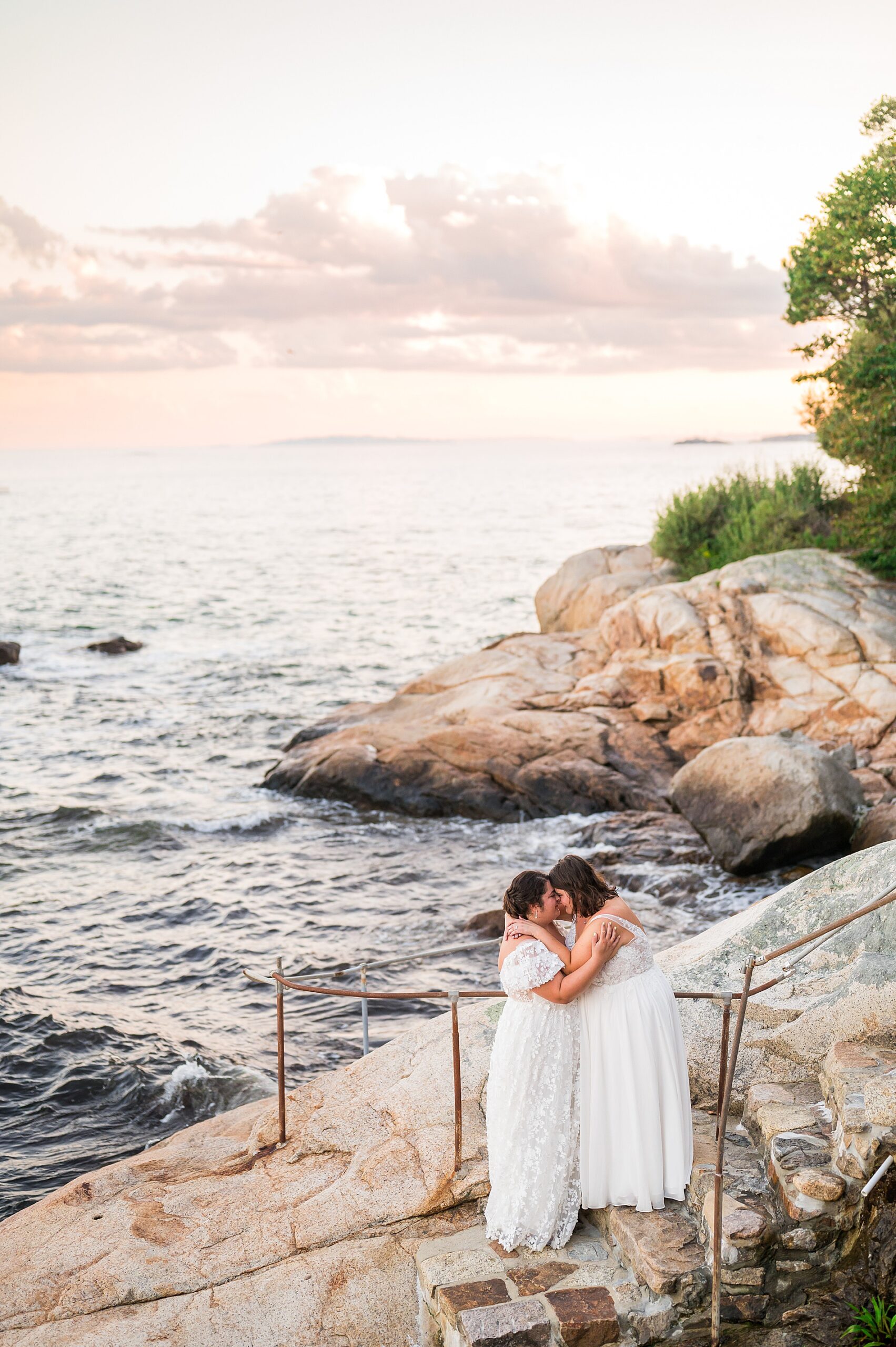 romantic wedding portraits on the cliff by the ocean