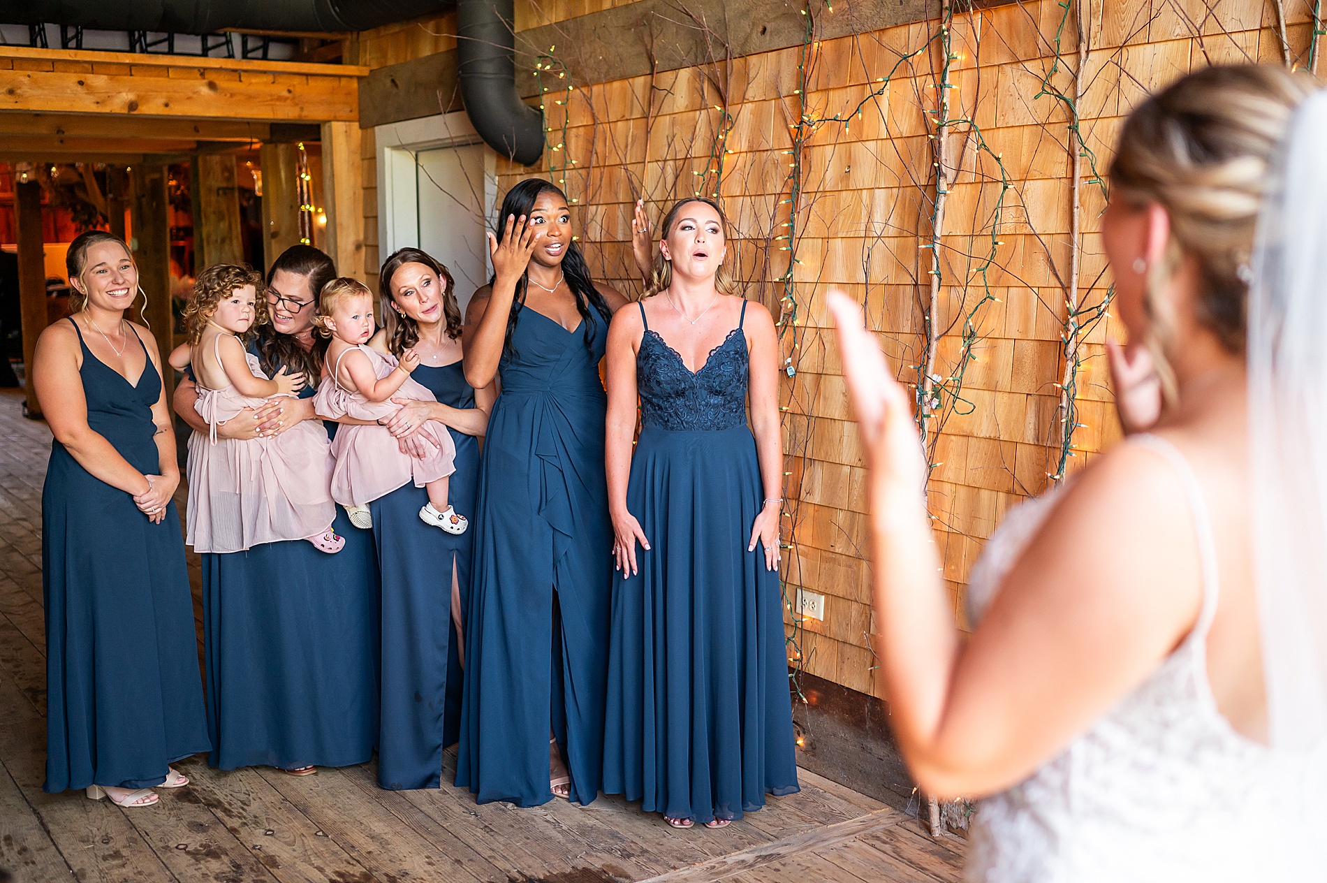 brides first look with bridesmaids