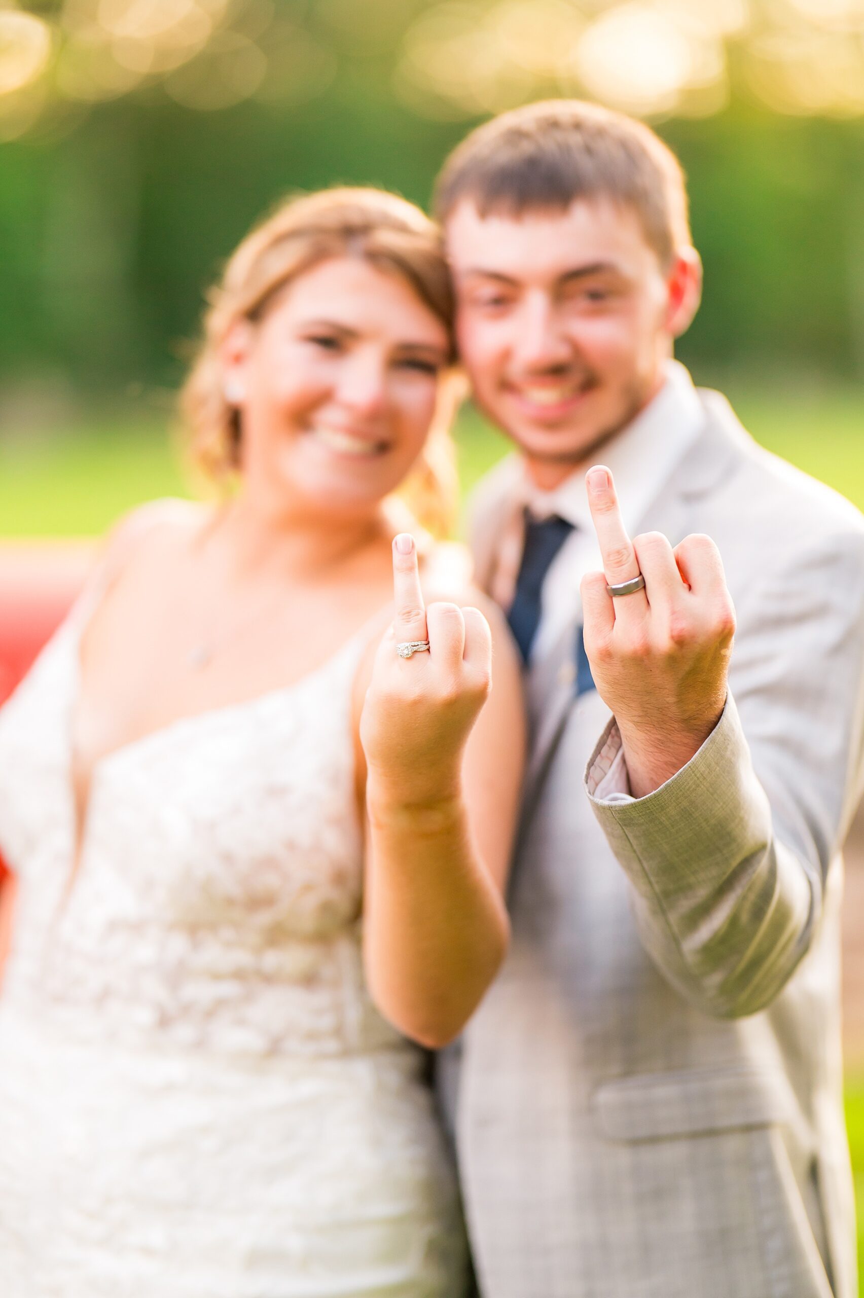 newlywed portraits showing off wedding rings
