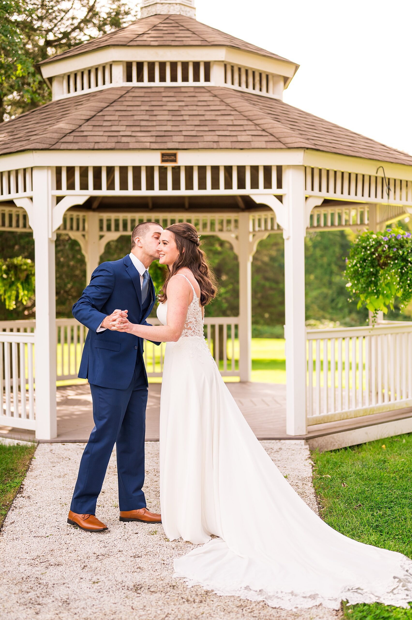 bride and groom kiss by gazebo at North Shore Wedding at The Hellenic Center