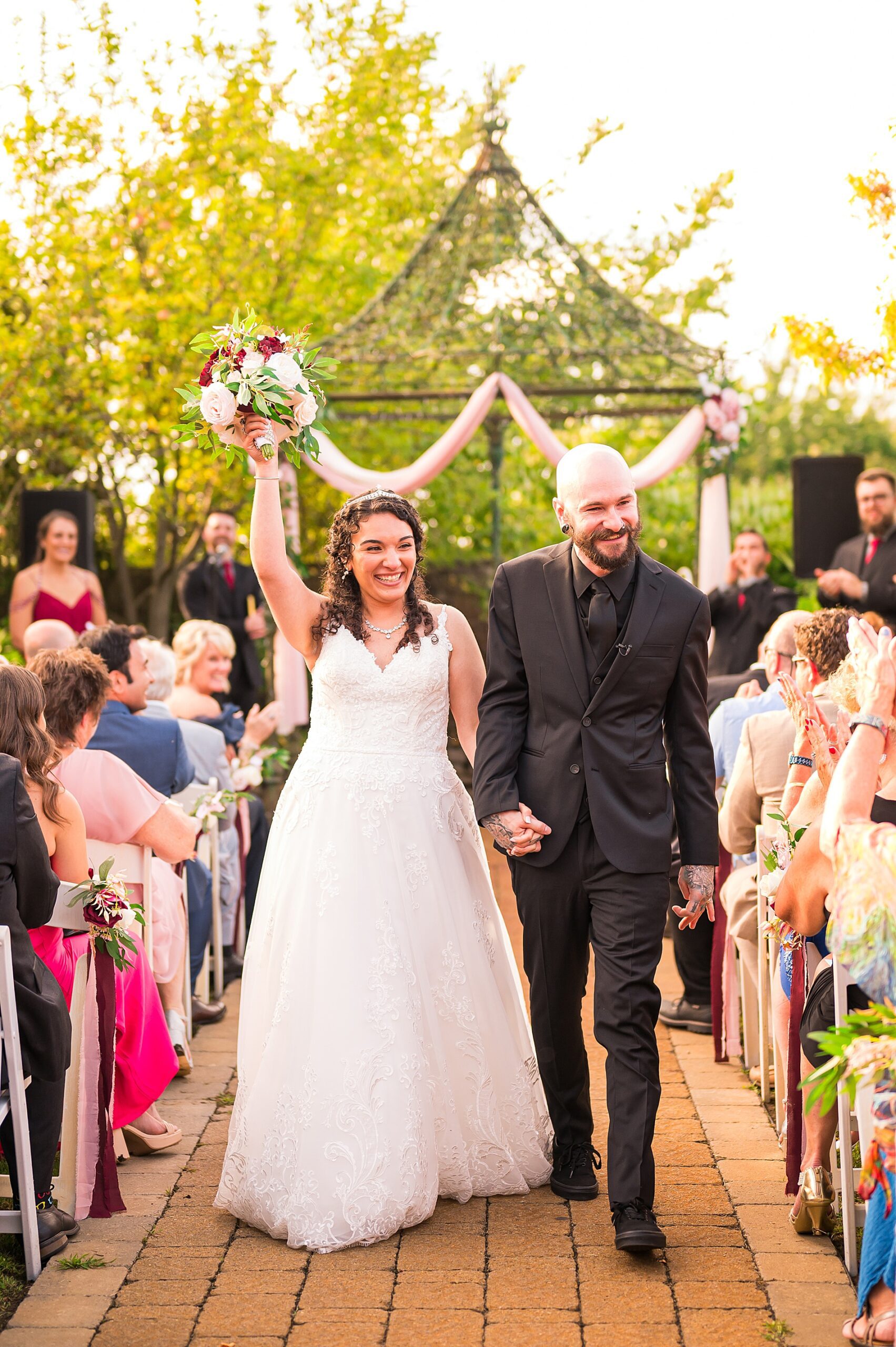 couple celebrate as they exit Dreamy Wedding at Granite Rose