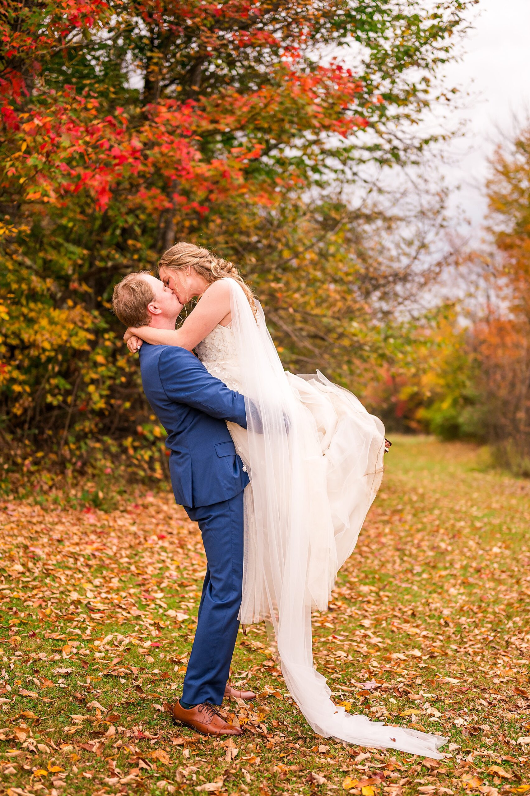newlyweds kiss from Enchanting Fall Wedding in Vermont