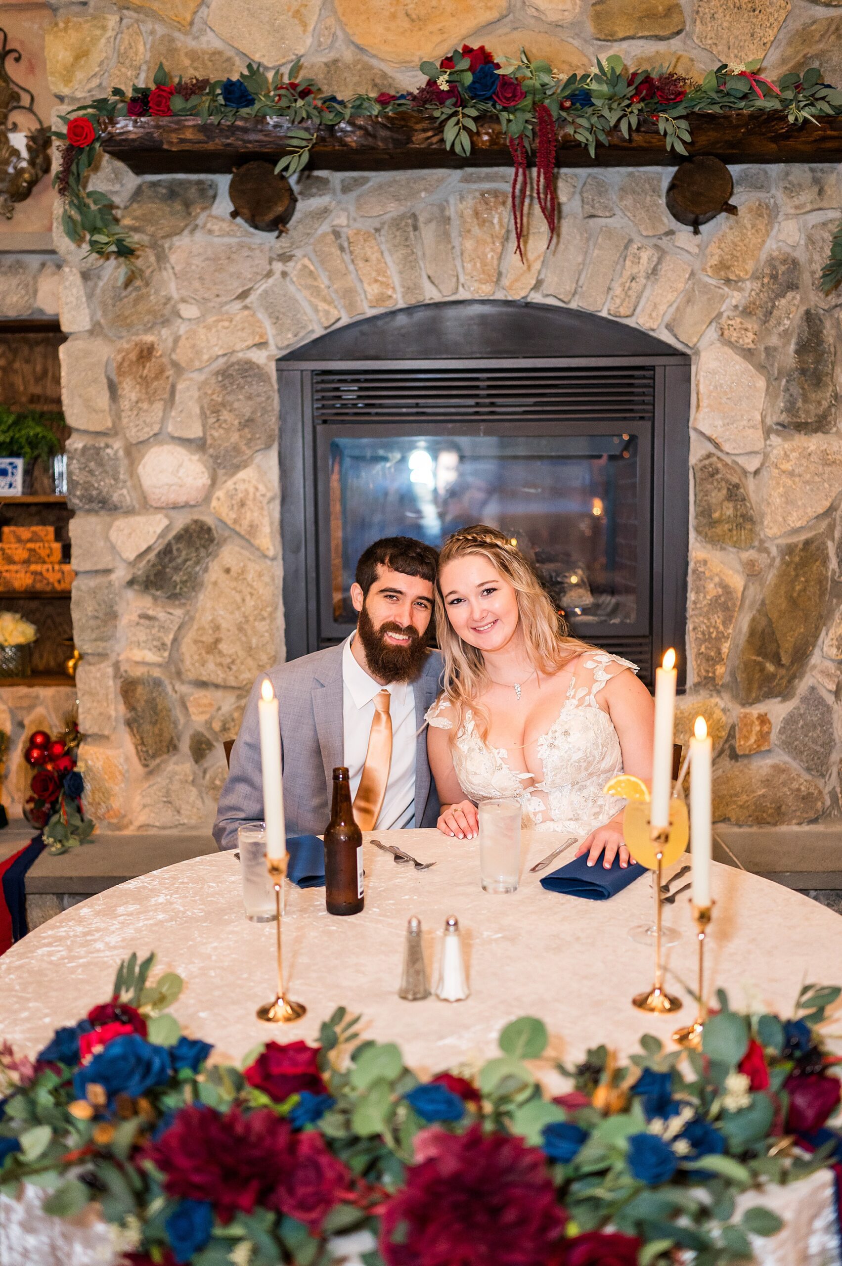 couple sit at table for dinner after wedding