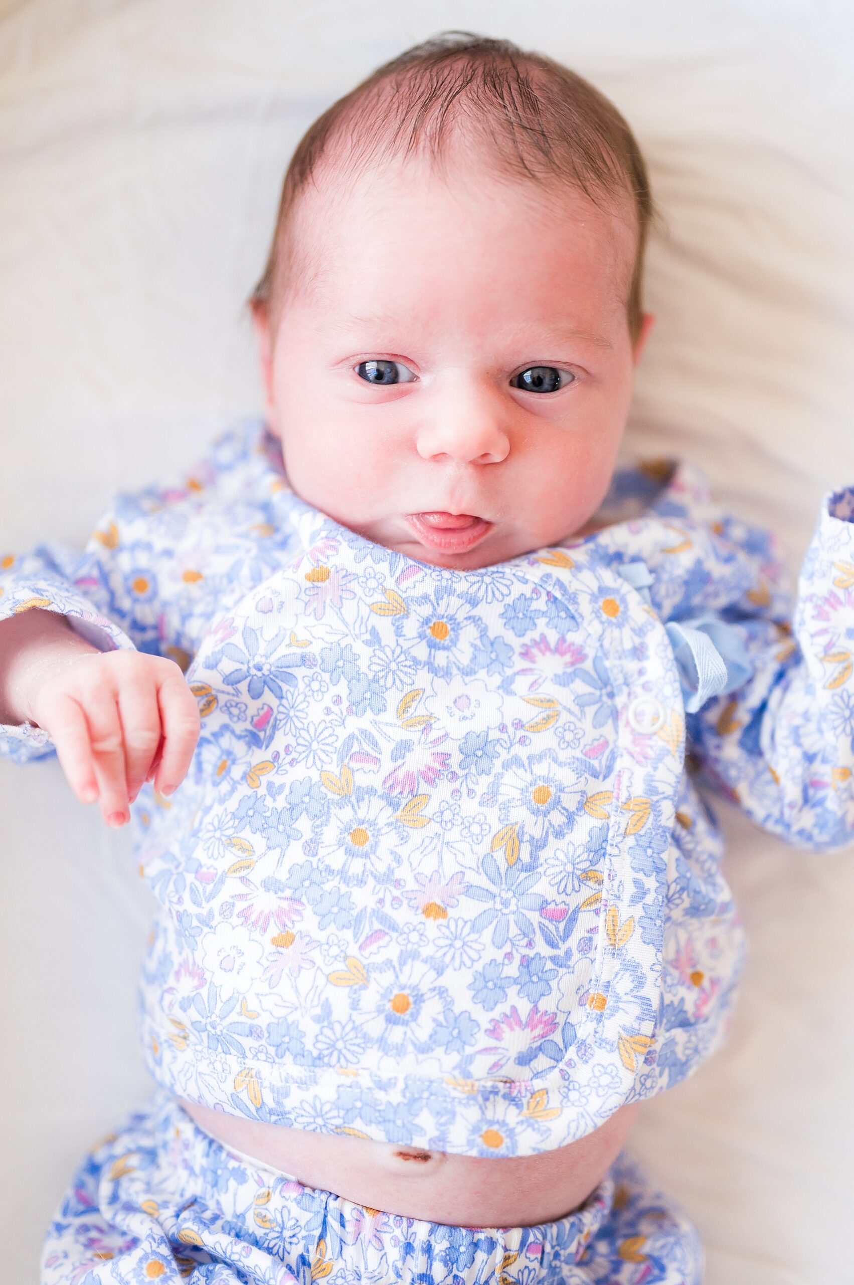 newborn girl makes faces during In-Home Lifestyle Newborn Session 