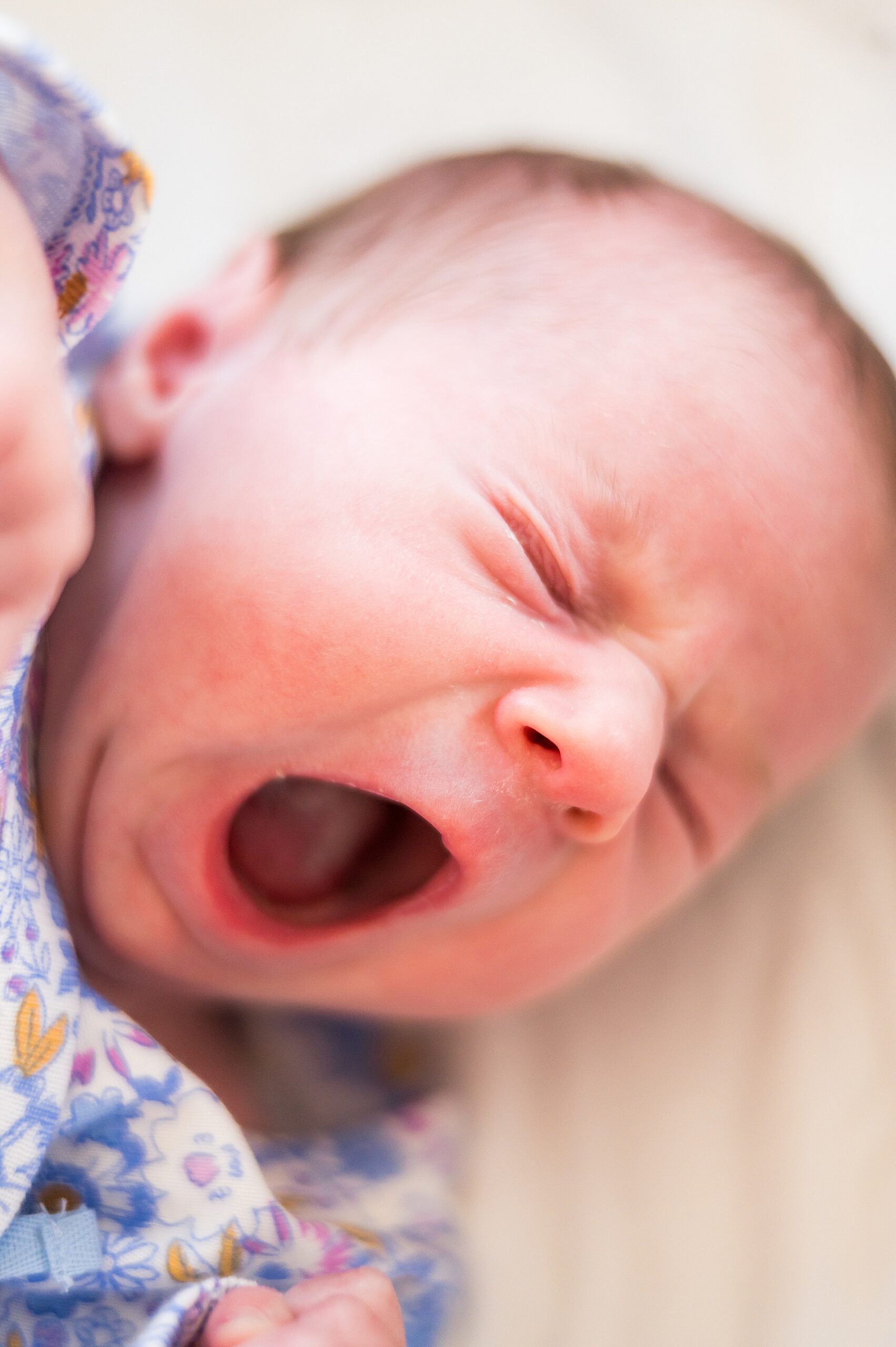 newborn yawns during In-Home Lifestyle Newborn Session 
