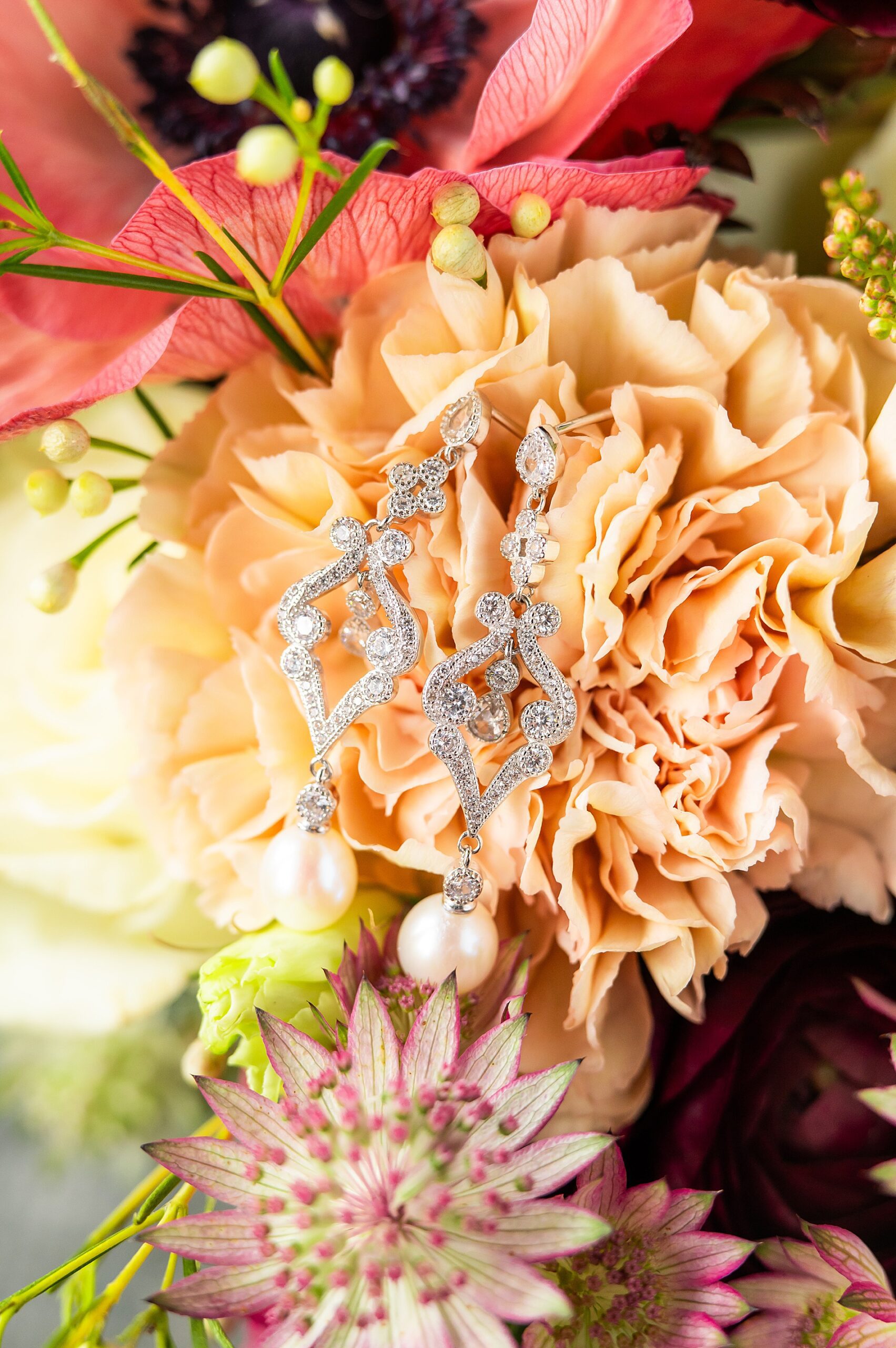 bride's earrings on bouquet 
