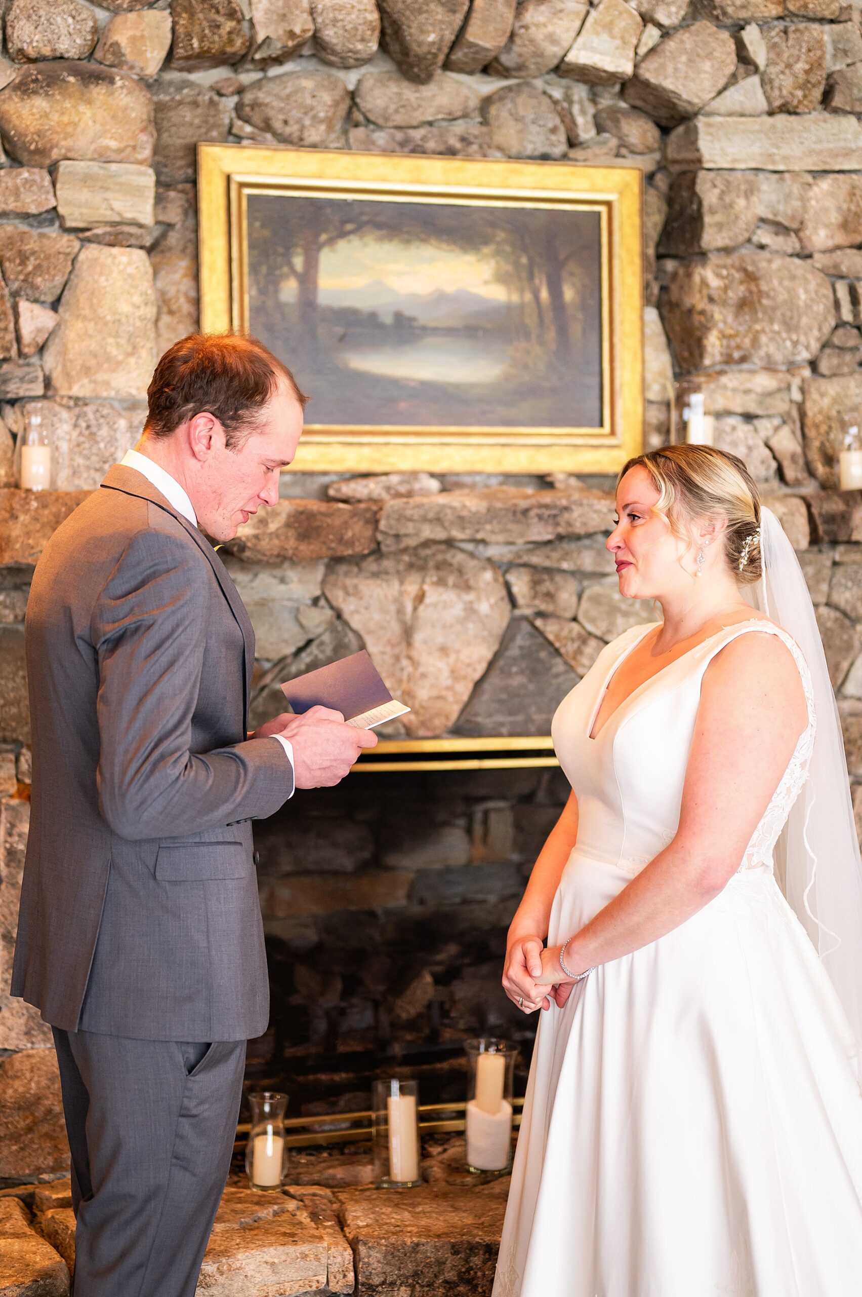 groom reads vows to bride during first look moment