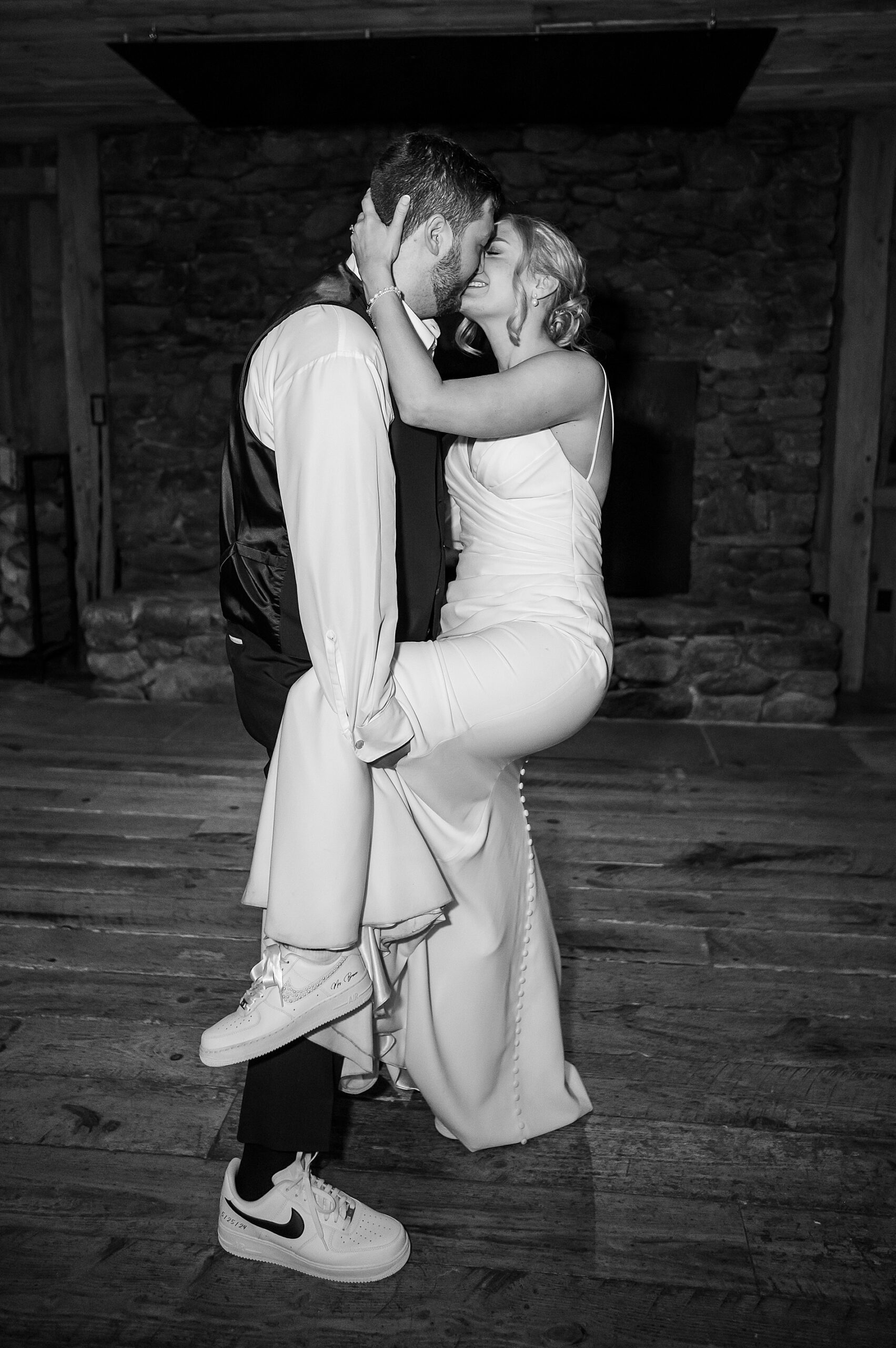 timeless wedding portraits of couple showing off their personalized Nikes