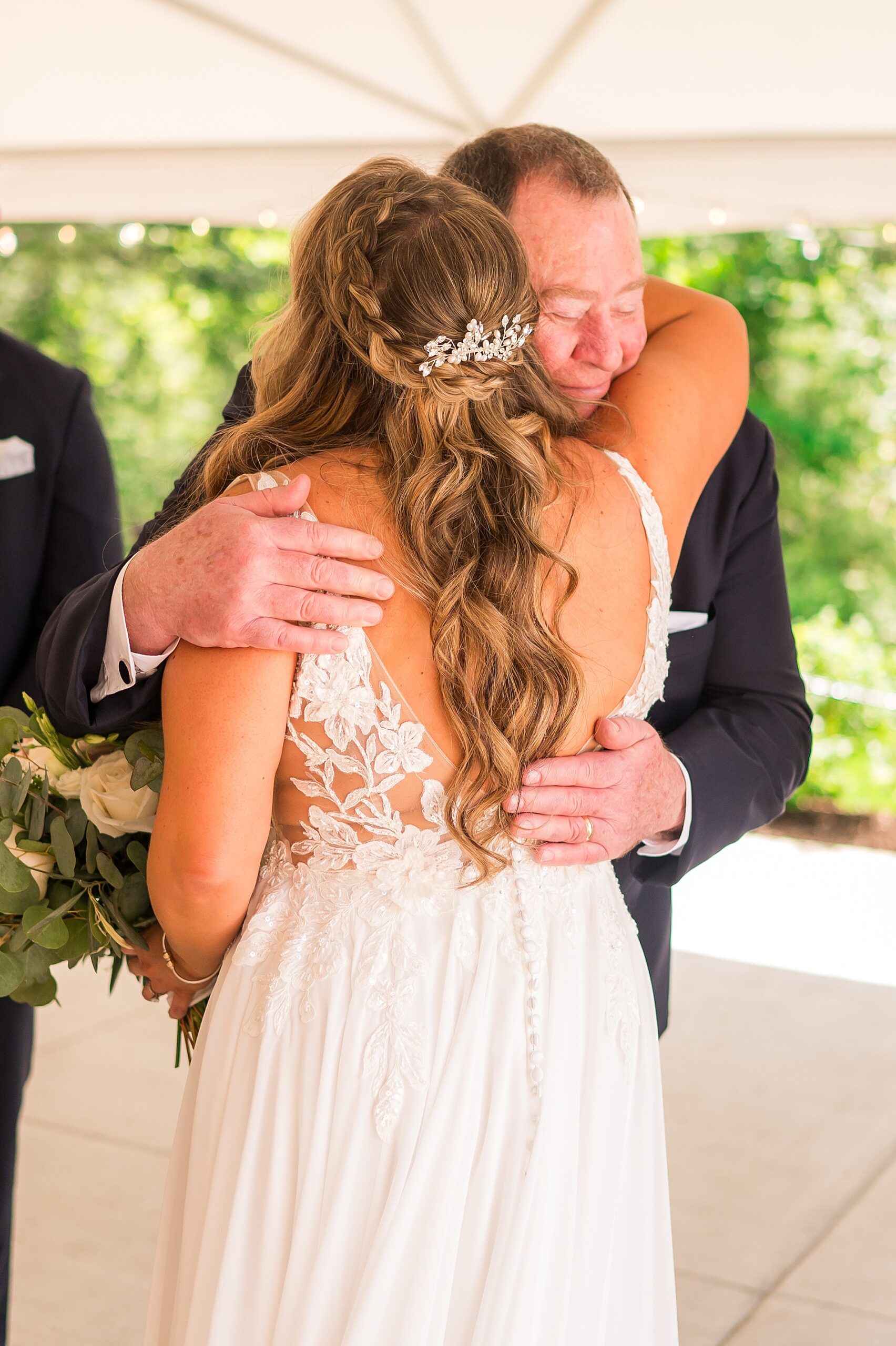 bride hugs stepdad