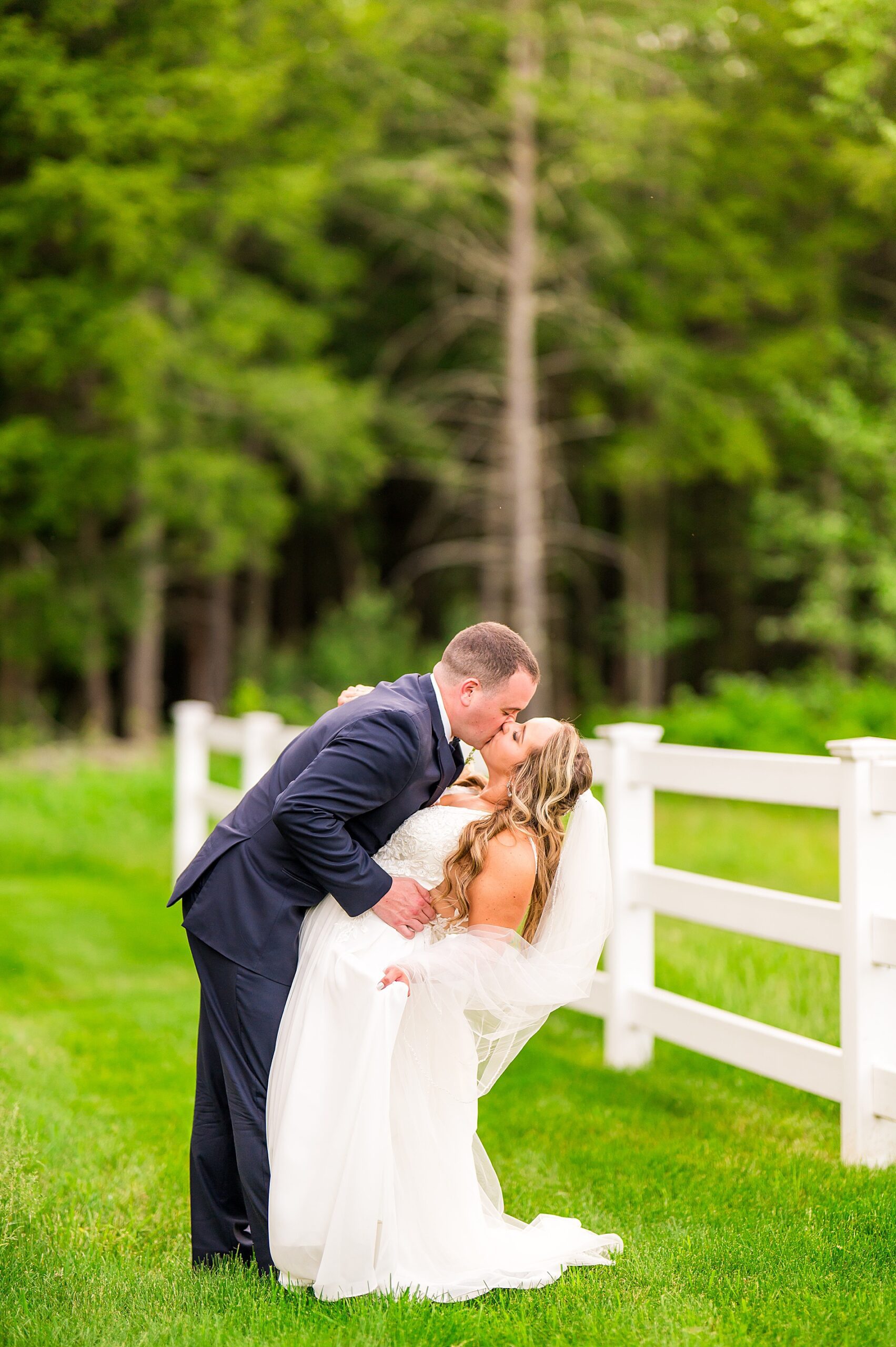newlyweds kiss at the Barn on Bull Meadow  