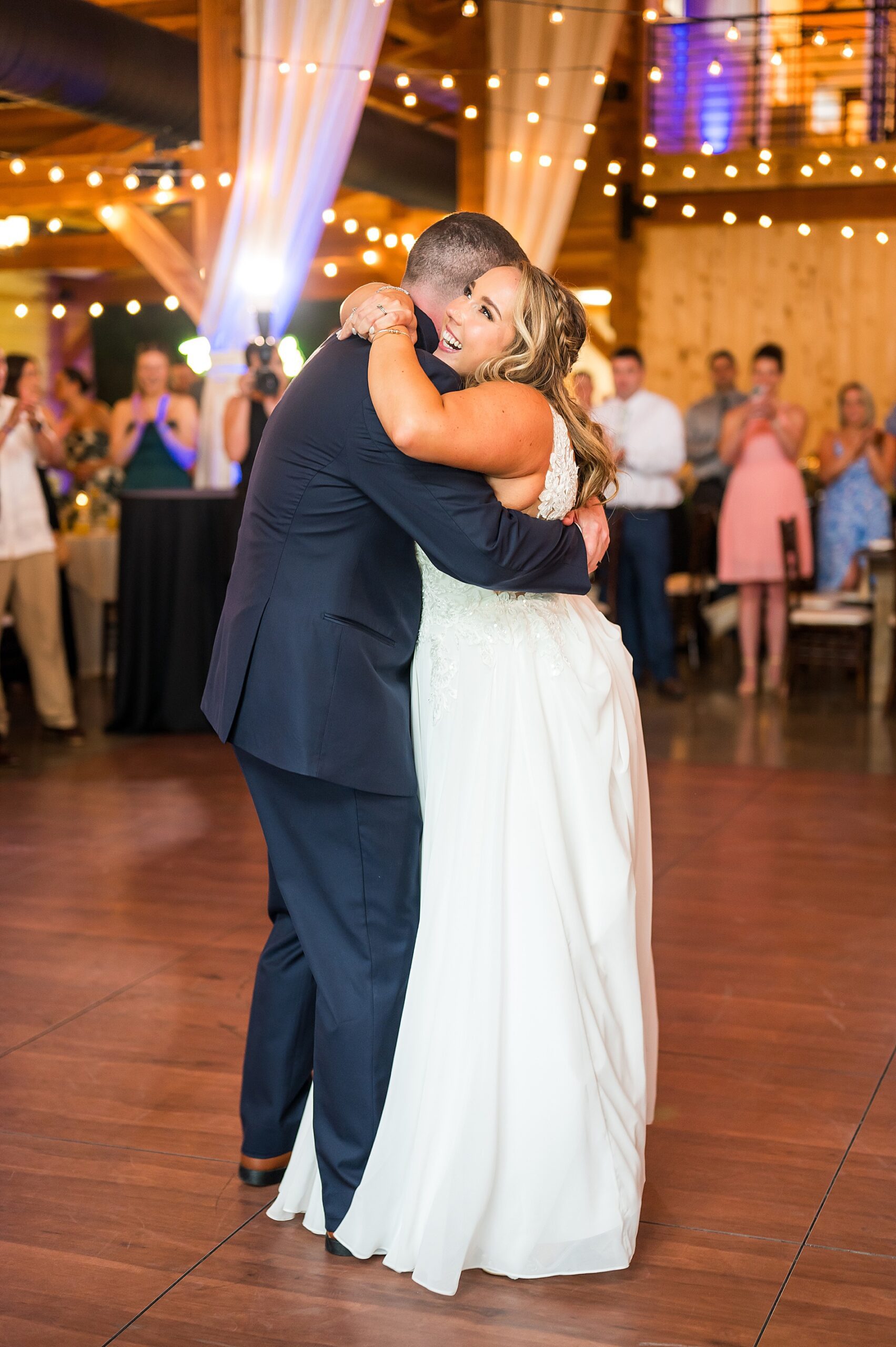 newlyweds hug on the dance floor