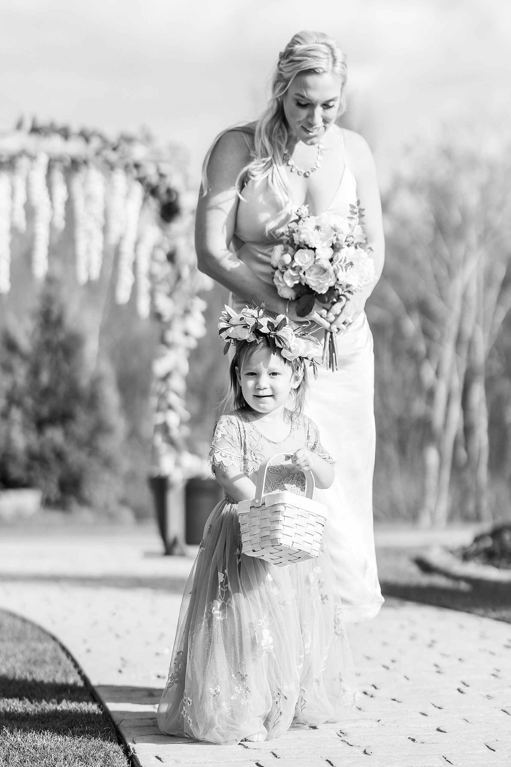 bridesmaid and flower girl walking down the aisle 