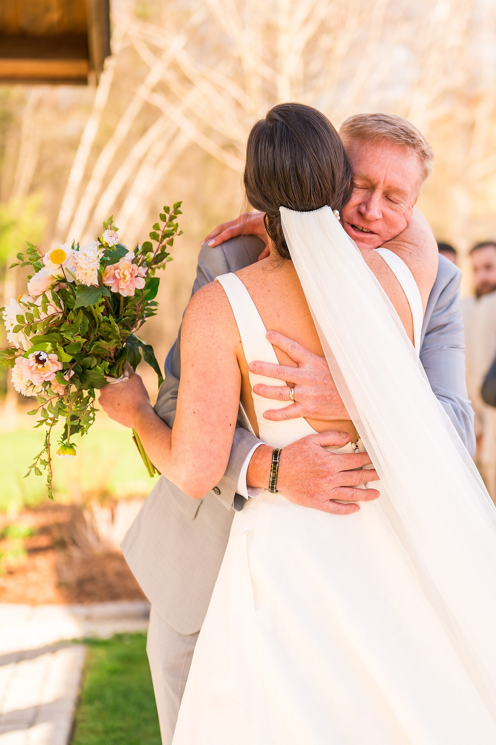 bride hugs her father