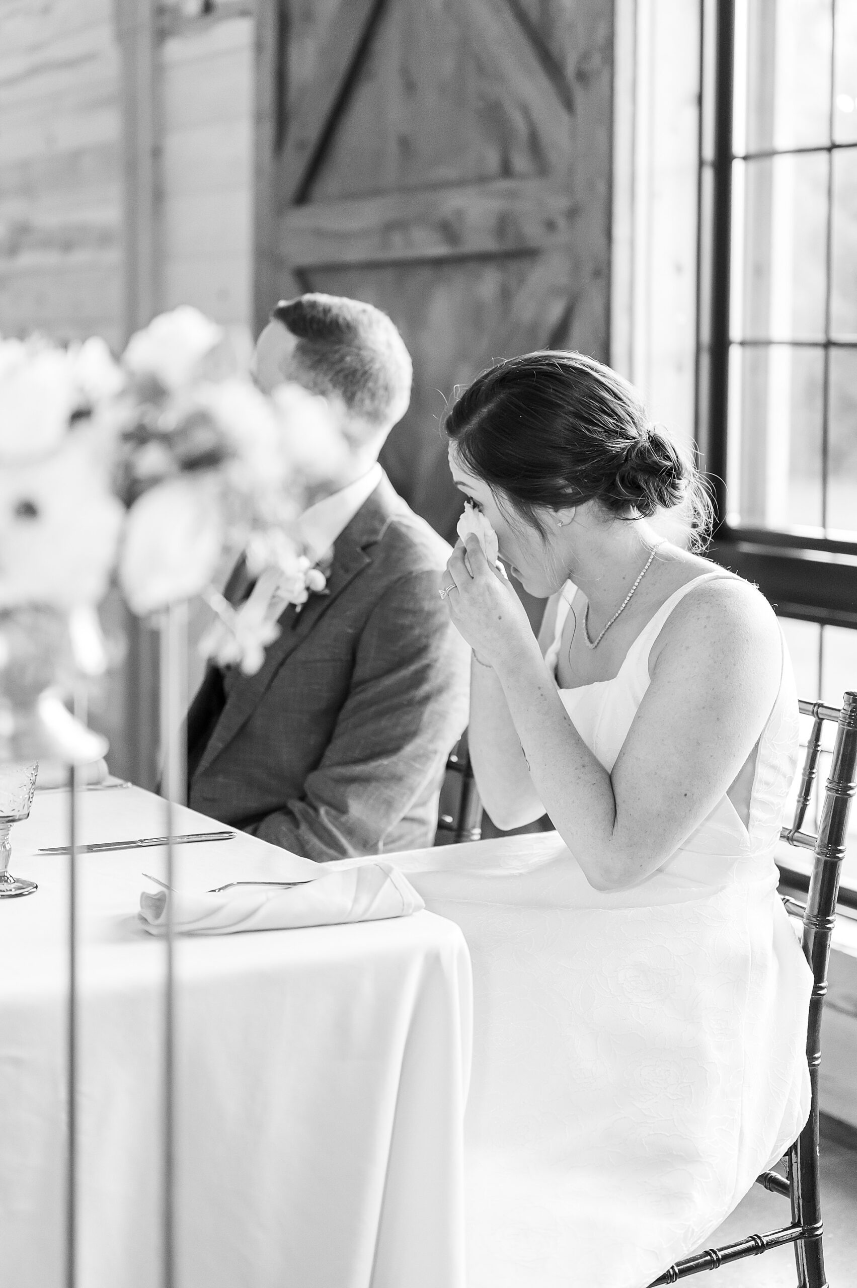 candid portrait of bride wiping away tears