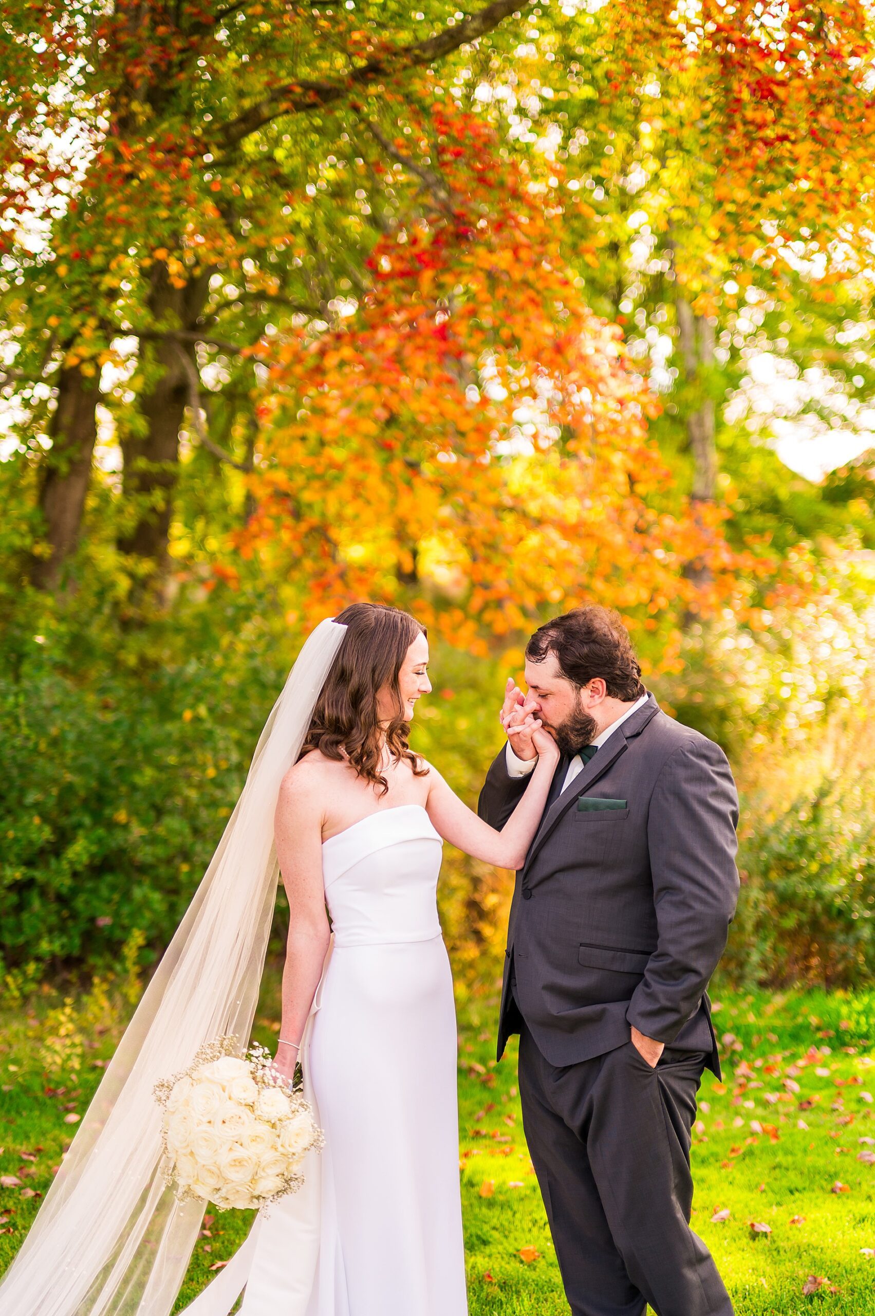 groom kisses bride's hand 