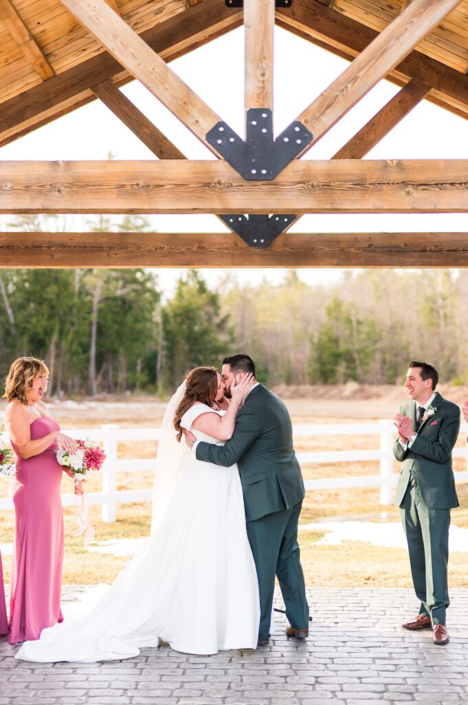 Bride and groom first kiss
