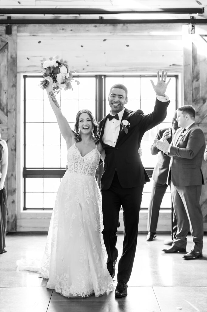 Bride and groom walking up aisle | barn at bull meadow | Spring wedding