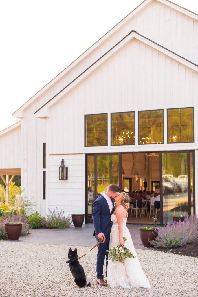 Bride and groom kiss |The Greenery