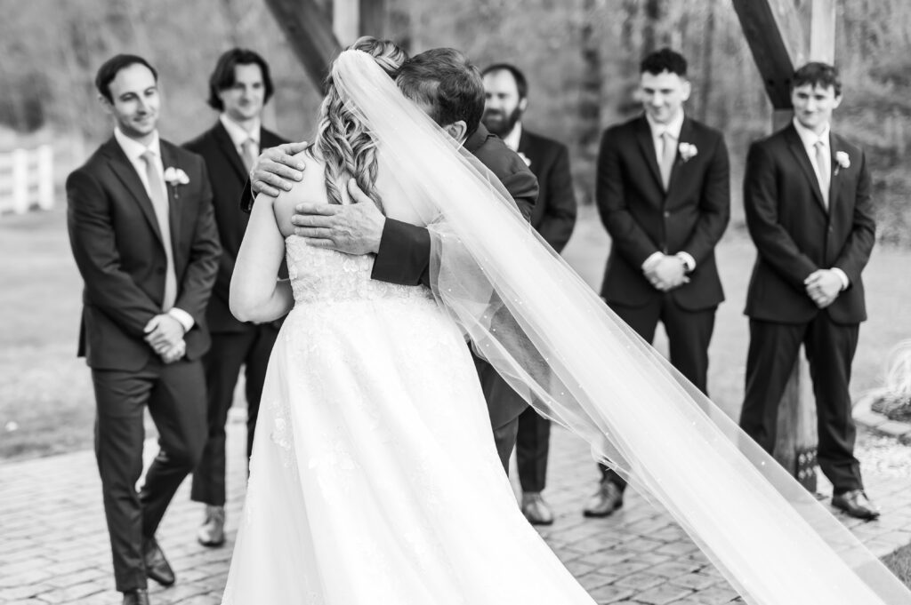 Bride hugging dad |