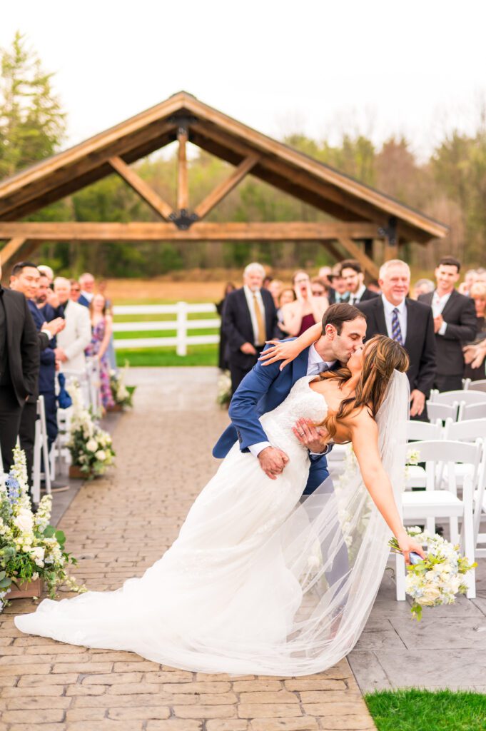 Bride and groom dip kiss | Dusty blue wedding