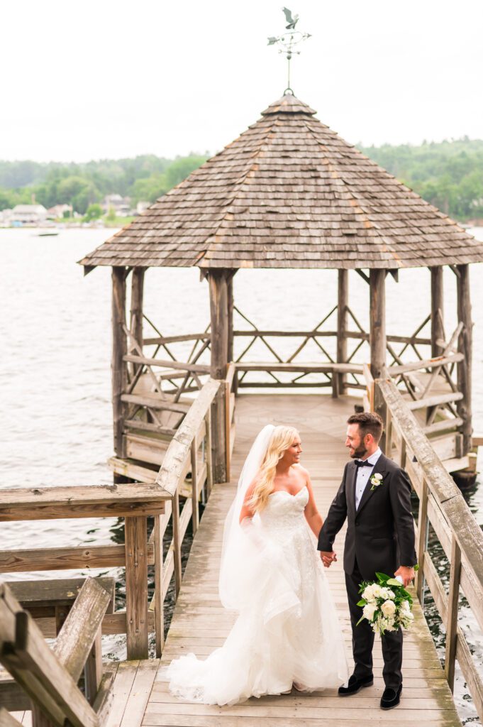 Wedding photos on dock | Lake Winnipesaukee